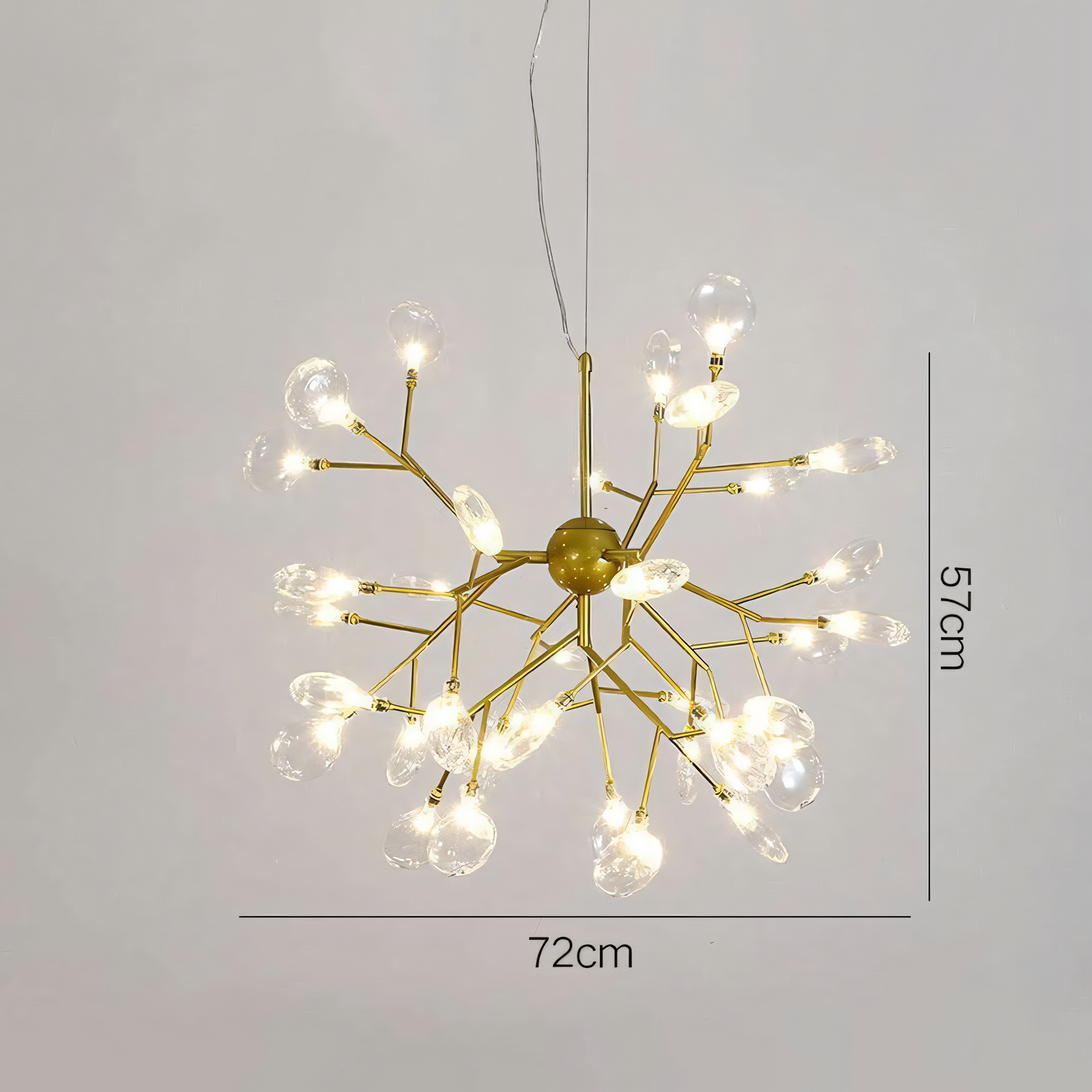 The Blaze Round Chandelier casts a warm, inviting glow on a modern beach villa living room.