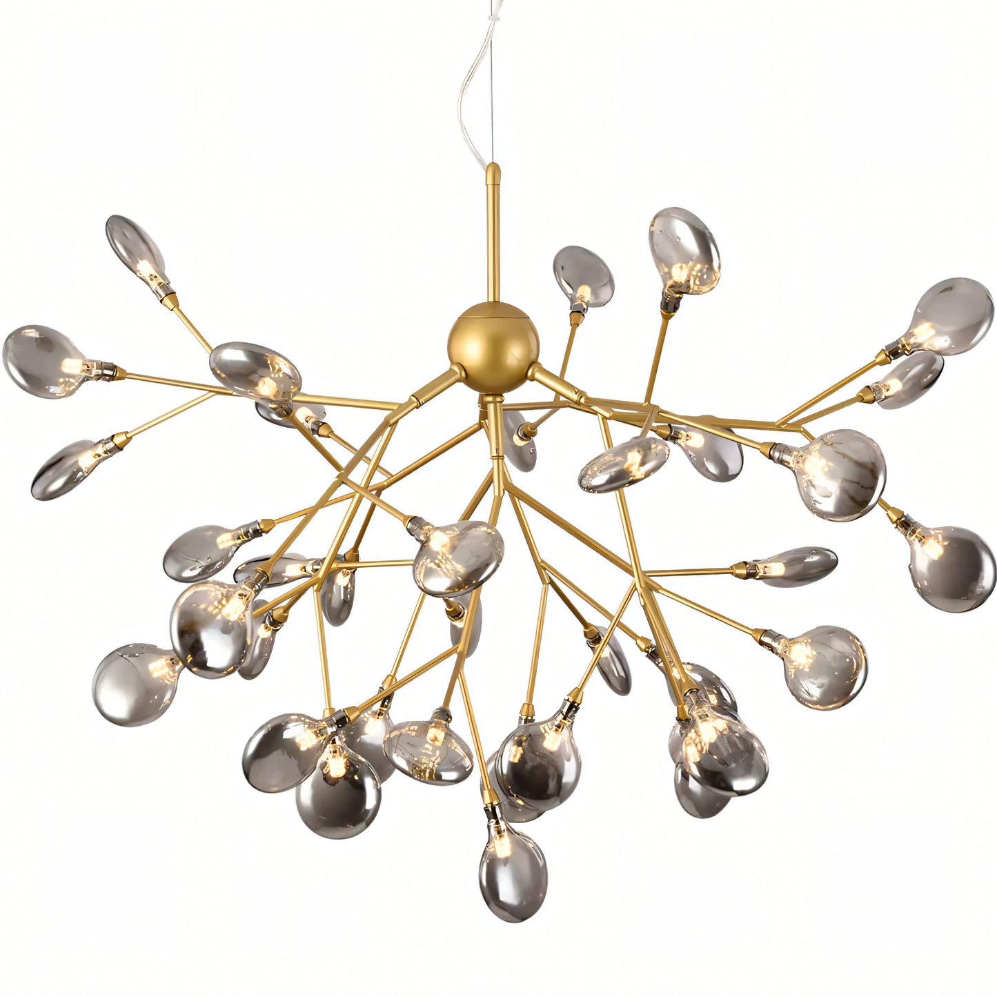 The Blaze Round Chandelier, a nautical-inspired centerpiece, hangs above a dining table in a beach villa.