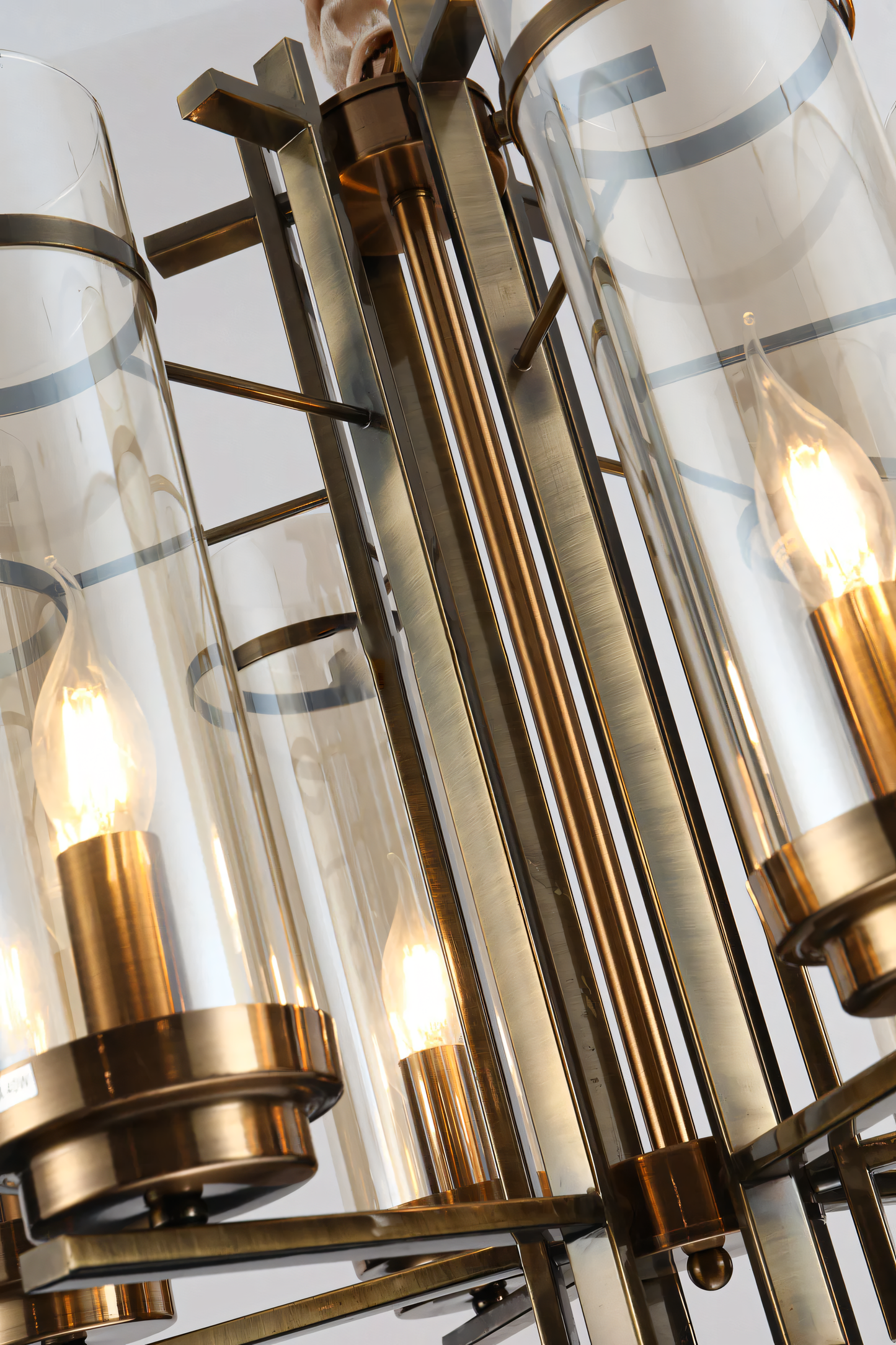 Sleek electroplated metal gold chandelier with amber glow