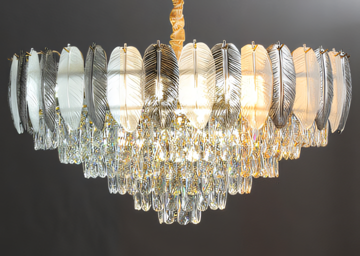 This elegant gold chandelier features a classic round design with cascading crystal feathers for a touch of whimsical charm.