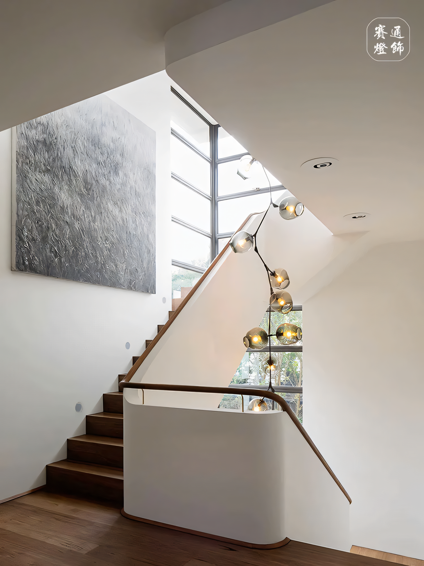 Linear double-height chandelier with a dramatic, earthy ambiance