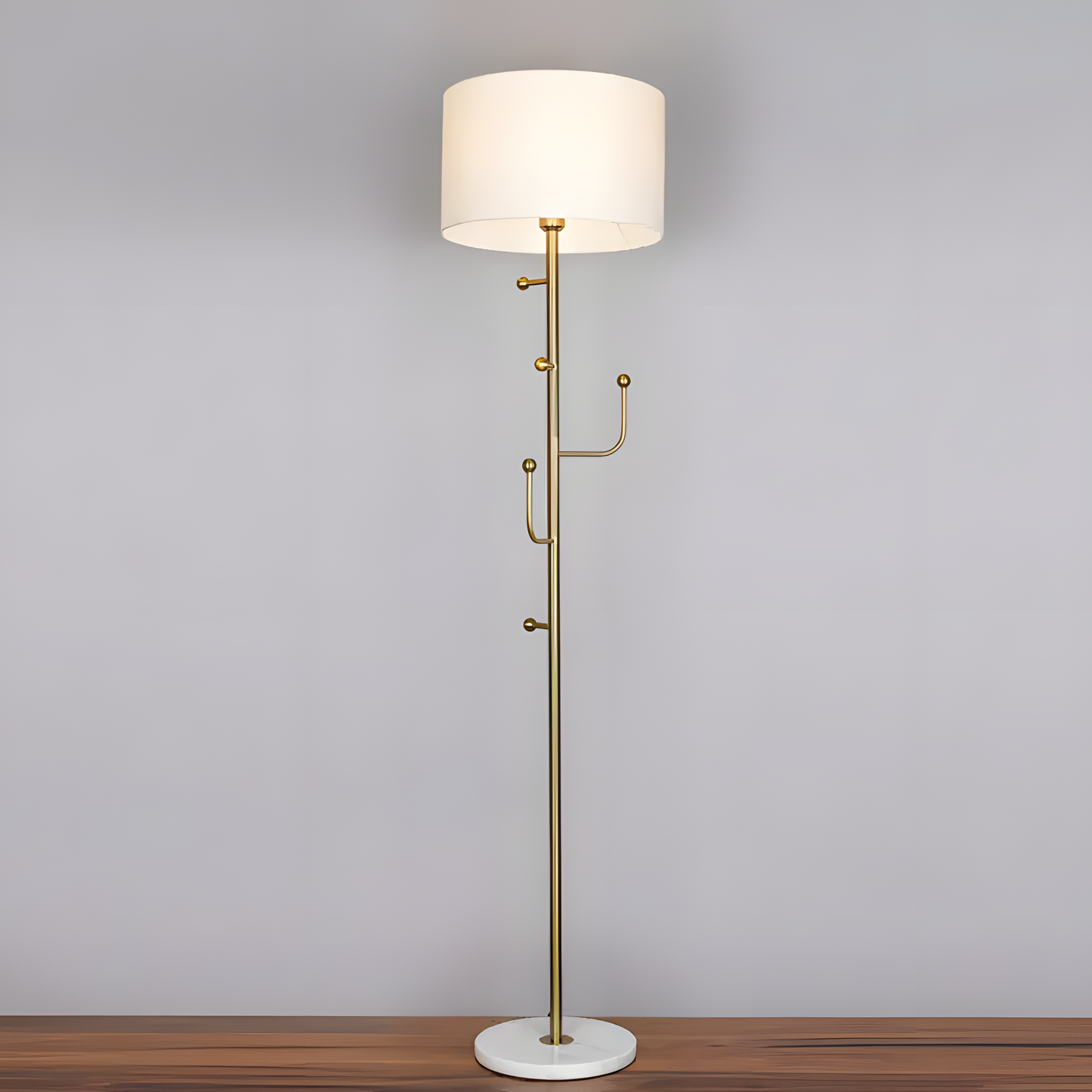 Soft, neutral-hued fabric shade of the Discovered (Marble) Floor Lamp