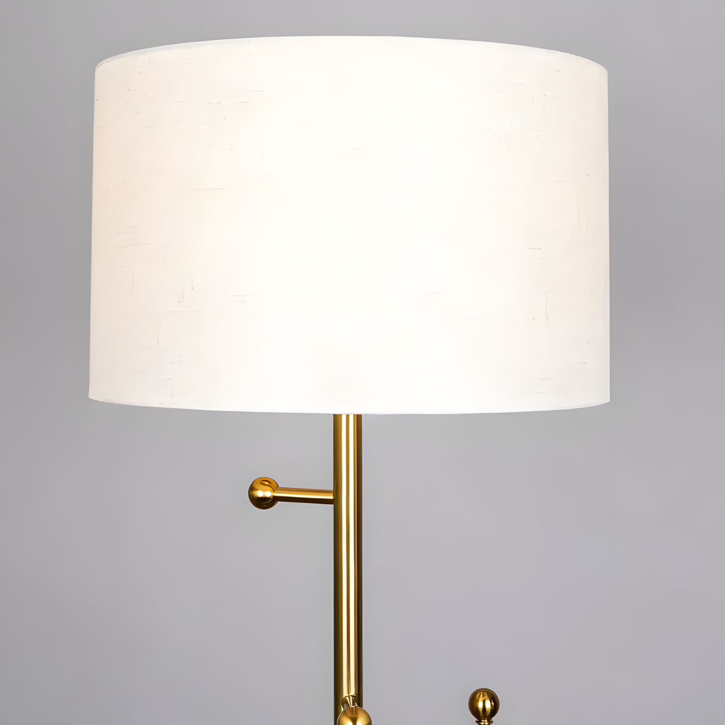 Soft, neutral-hued fabric shade of the Discovered (Marble) Floor Lamp