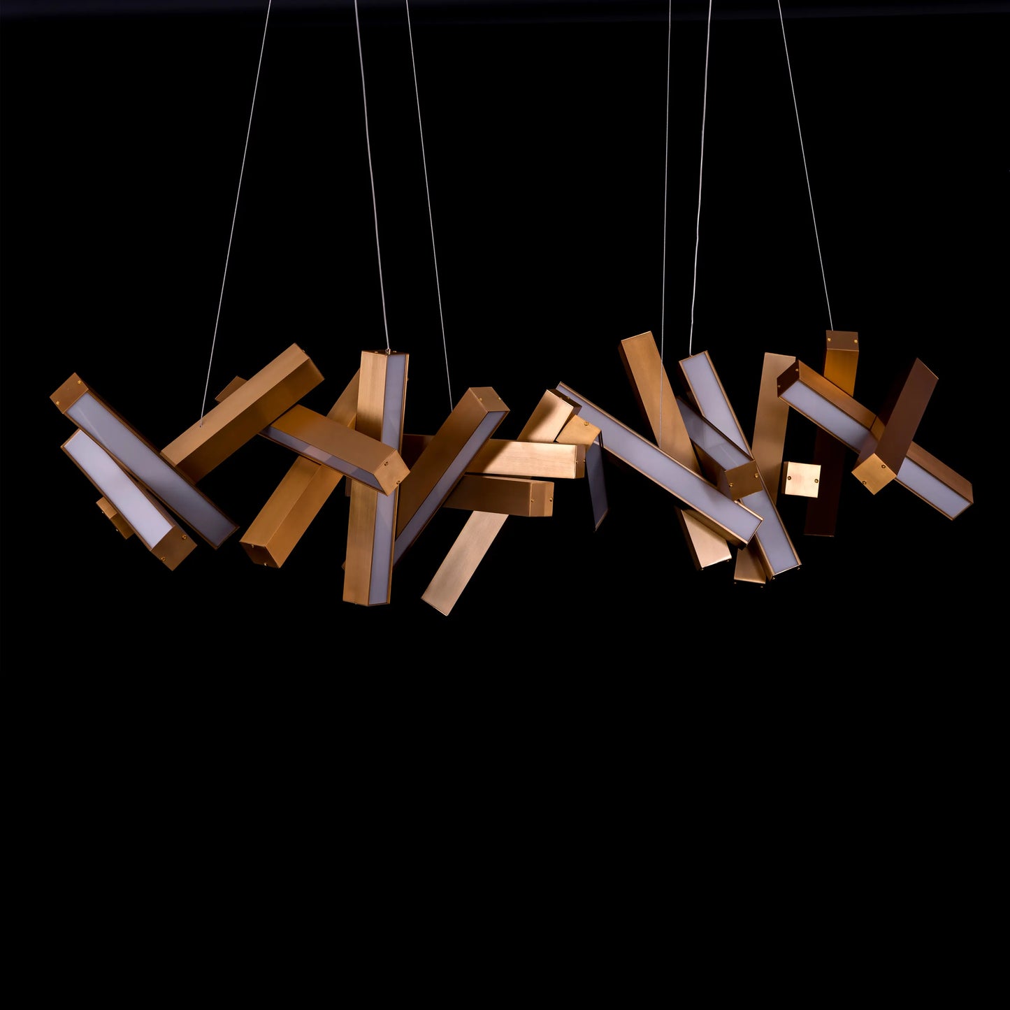 Large "Glow Miles" gold chandelier with multiple LED light sources, dramatically illuminated in a spacious, modern room.
