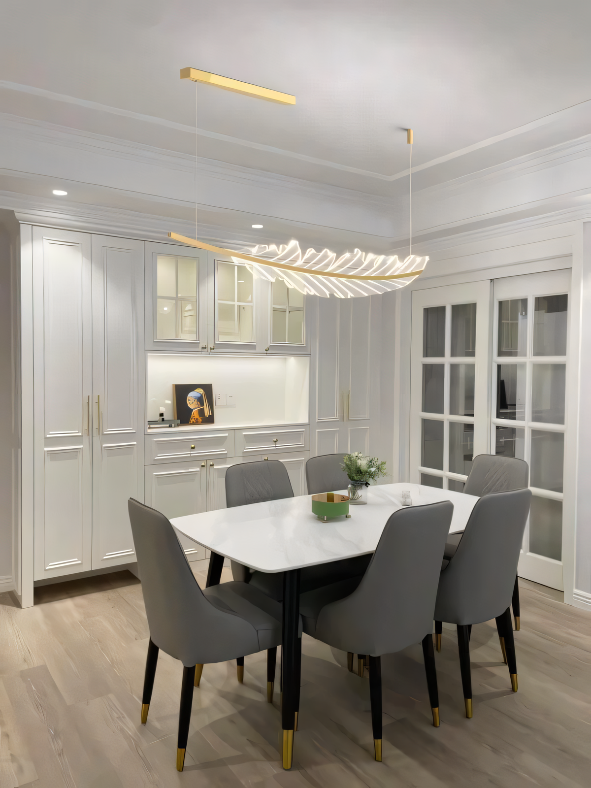 Delicate gold LED leaf chandelier that illuminates a grand living space