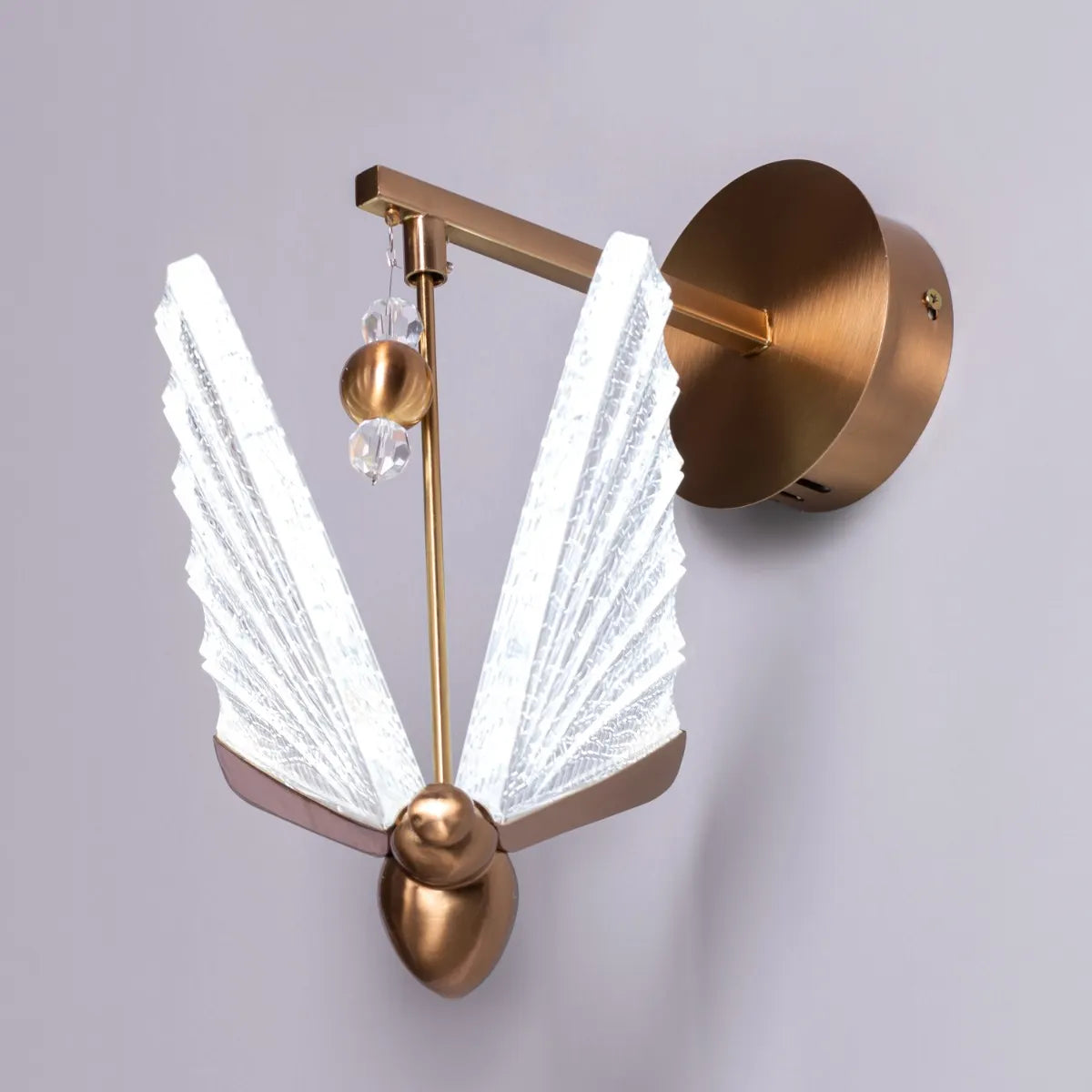 Butterfly Wishes Wall Light - Enchanting and whimsical wall lighting fixture featuring delicate metal cutouts that resemble a graceful butterfly in flight, casting a mesmerizing play of light and shadow.