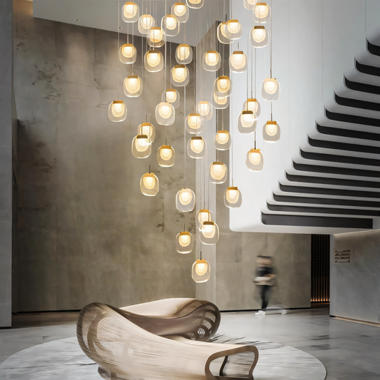 Diverse hanging light fixtures illuminate a modern interior space, showcasing various styles from minimalist pendants