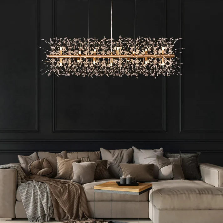 Collage of trending luxury chandelier designs featuring organic shapes, minimalist geometry, smart lighting, and oversized sculptural pieces in a modern interior setting