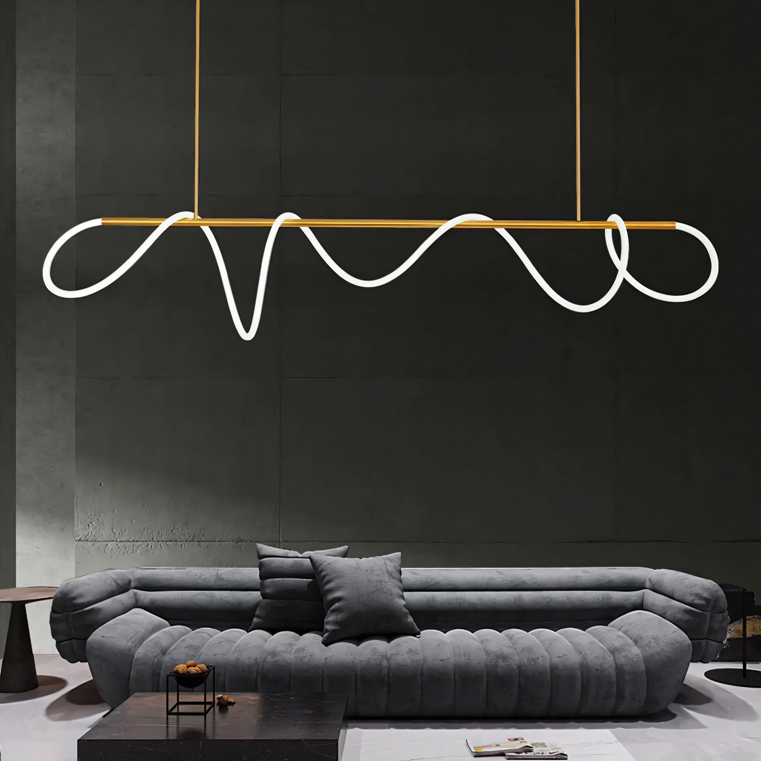 A white, round chandelier with rods tipped with LED bulbs hangs from a living room ceiling. The chandelier casts a warm, inviting glow on the space.