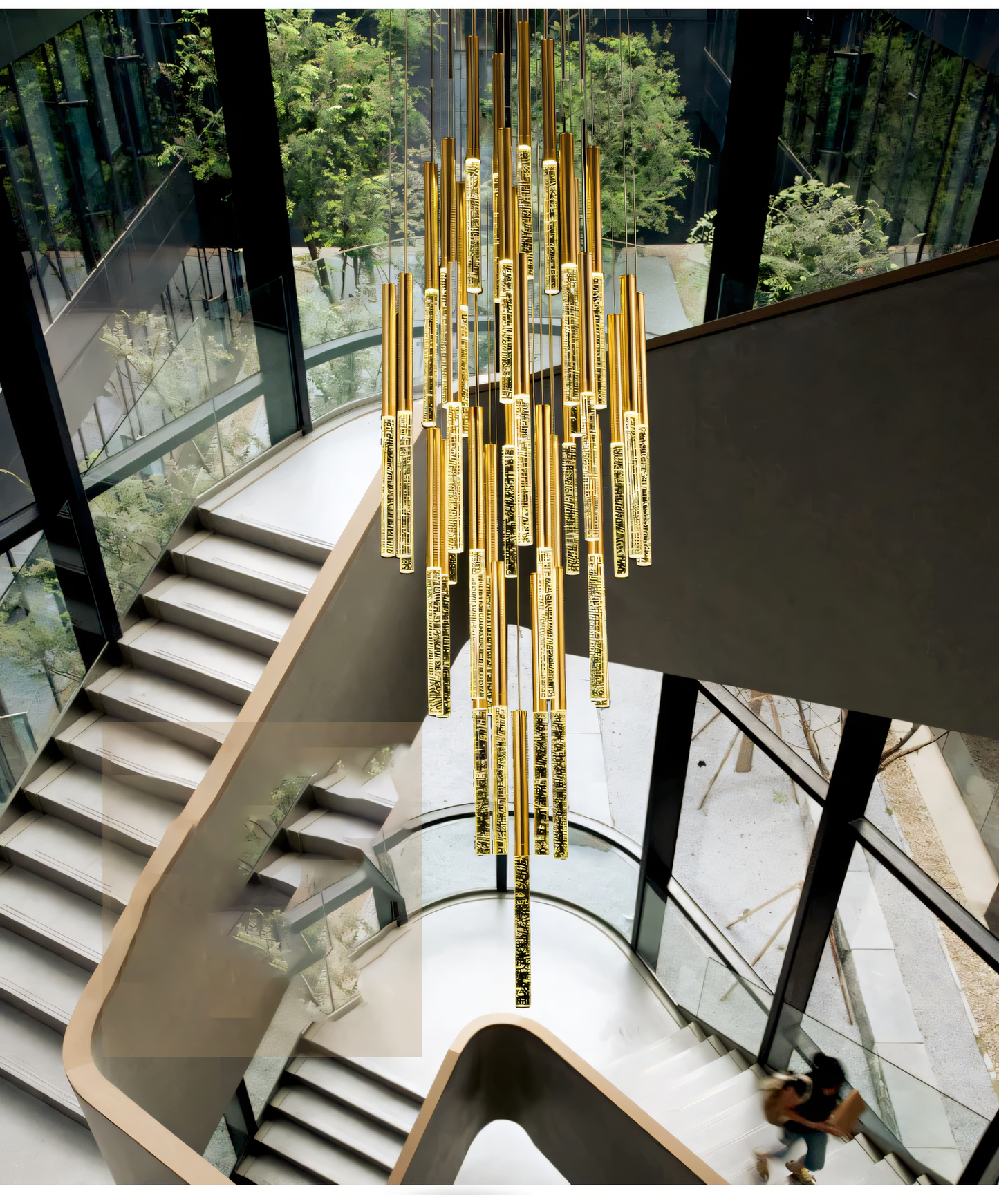 The Blaze Round Chandelier's design resembles a crown of leaves suspended amidst trees.