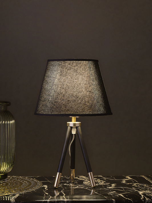 Regal tripod table lamp, mysterious ambiance