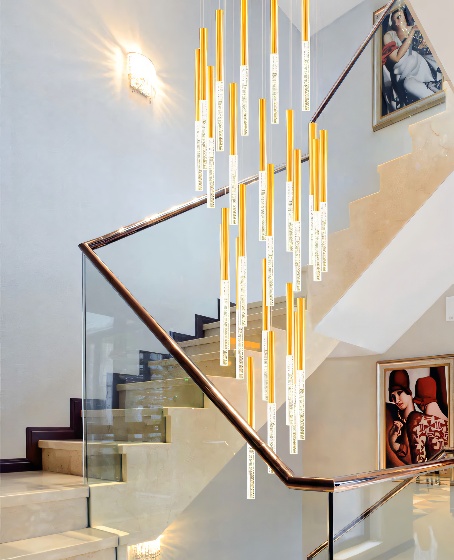 A gold, circular chandelier with rods tipped with LED bulbs hangs from a dining room ceiling. The chandelier casts a warm, inviting glow on the space.