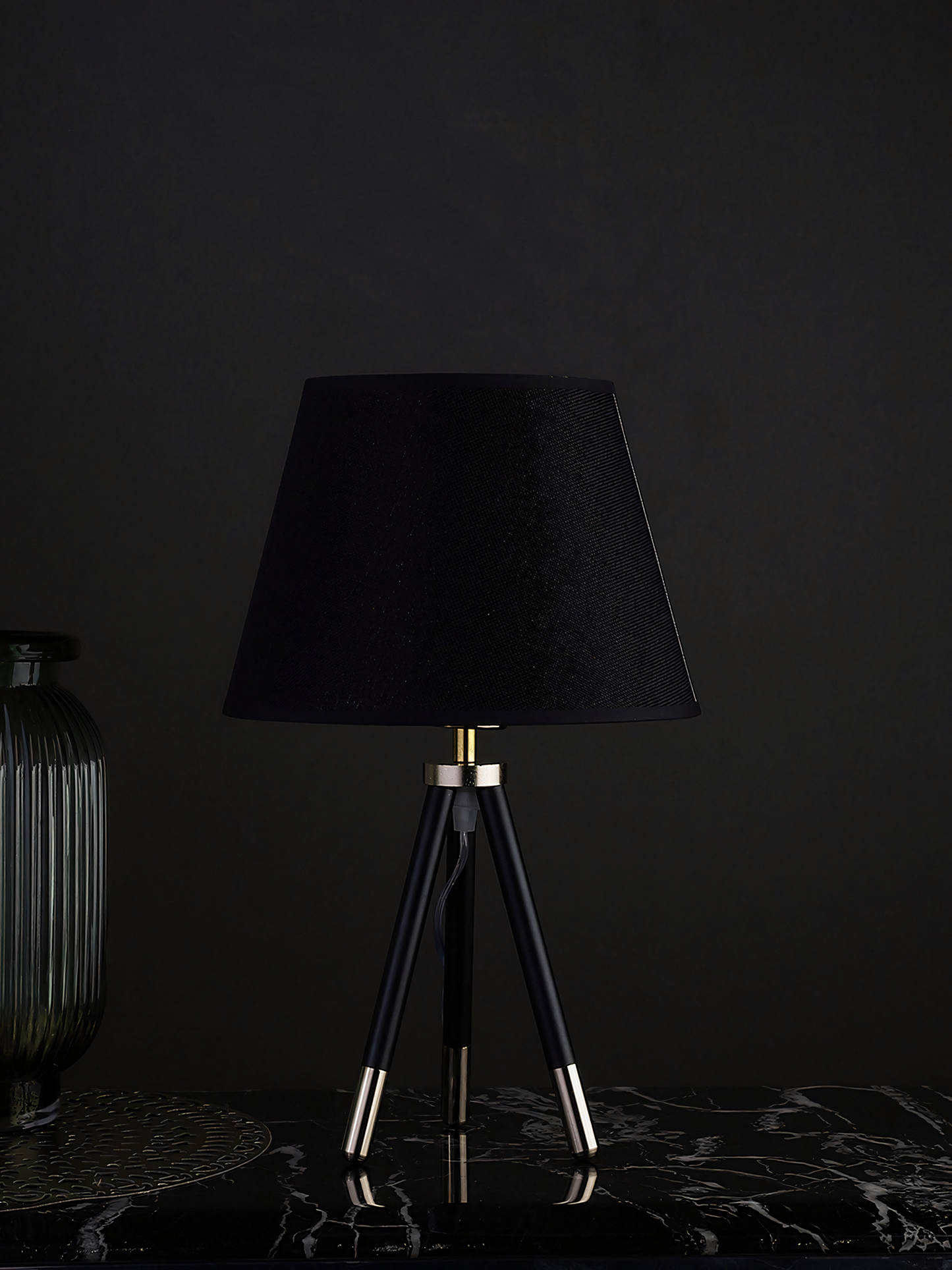 Dramatic black and gold lamp, whispers of secrets