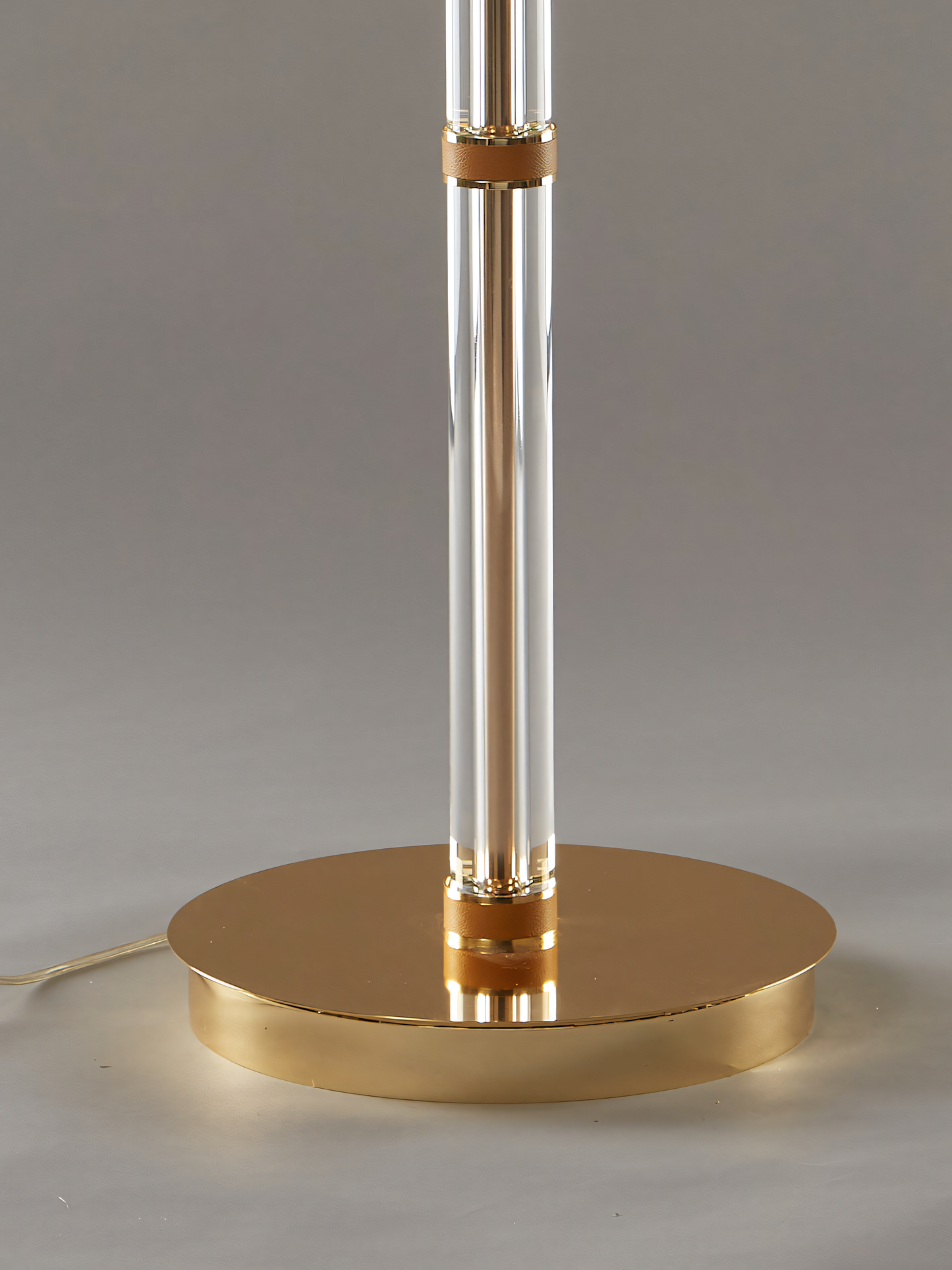 Slender, metal base of the Ruth Floor Lamp