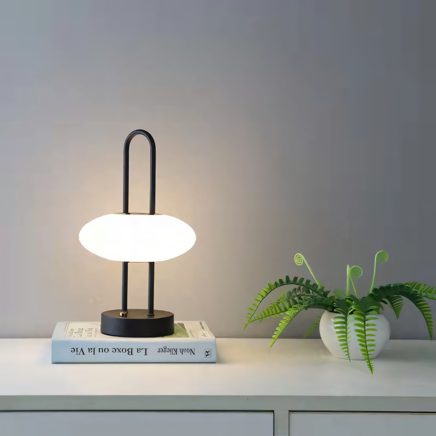 Cordless table lamp with glass shade