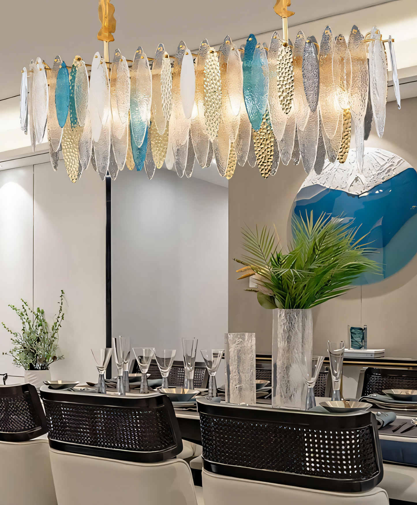 The Beach View Oval Chandelier bathes a hotel lobby in a soft, blue and white light, reminiscent of the ocean.