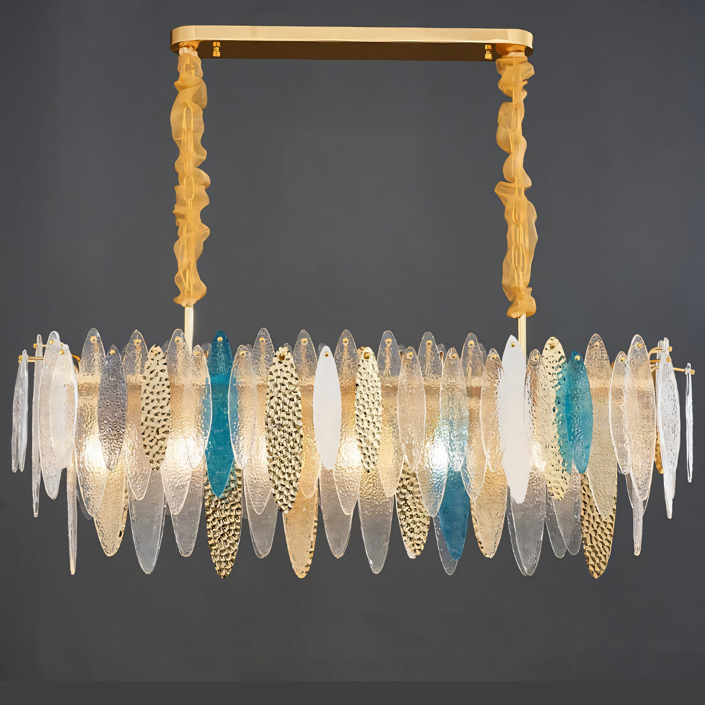 A close-up of the Beach View Oval Chandelier reveals its intricate oval shape, white finish, and gold accents.