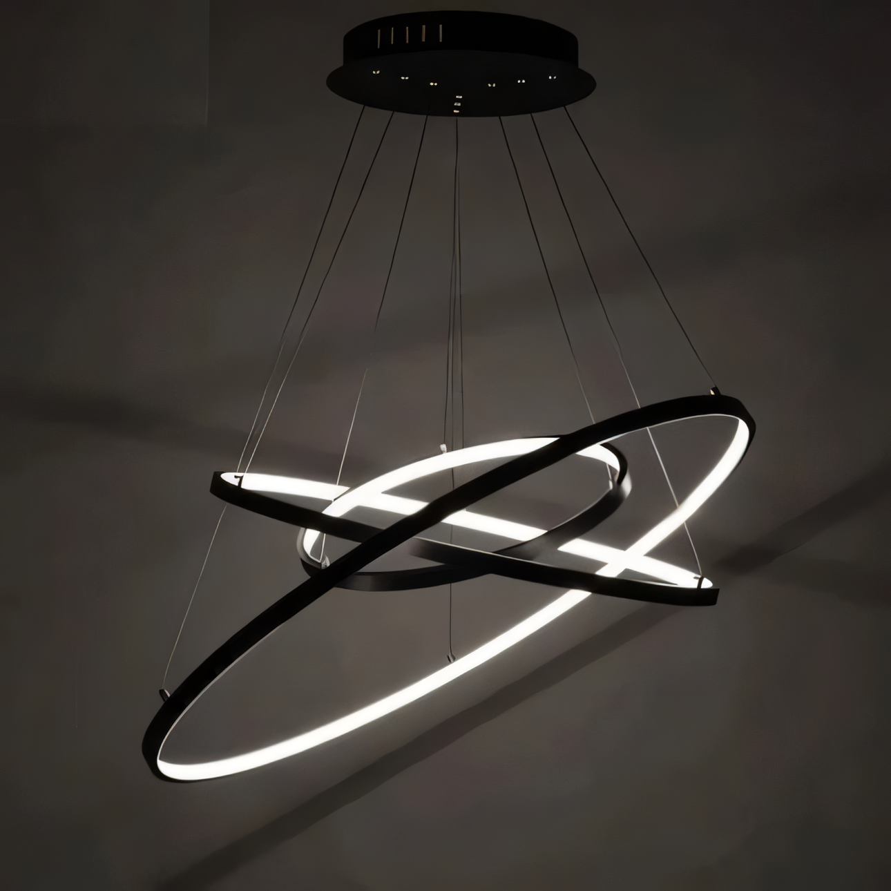 The Modern Zenith Chandelier adds a touch of modern luxury to a minimalist living room.