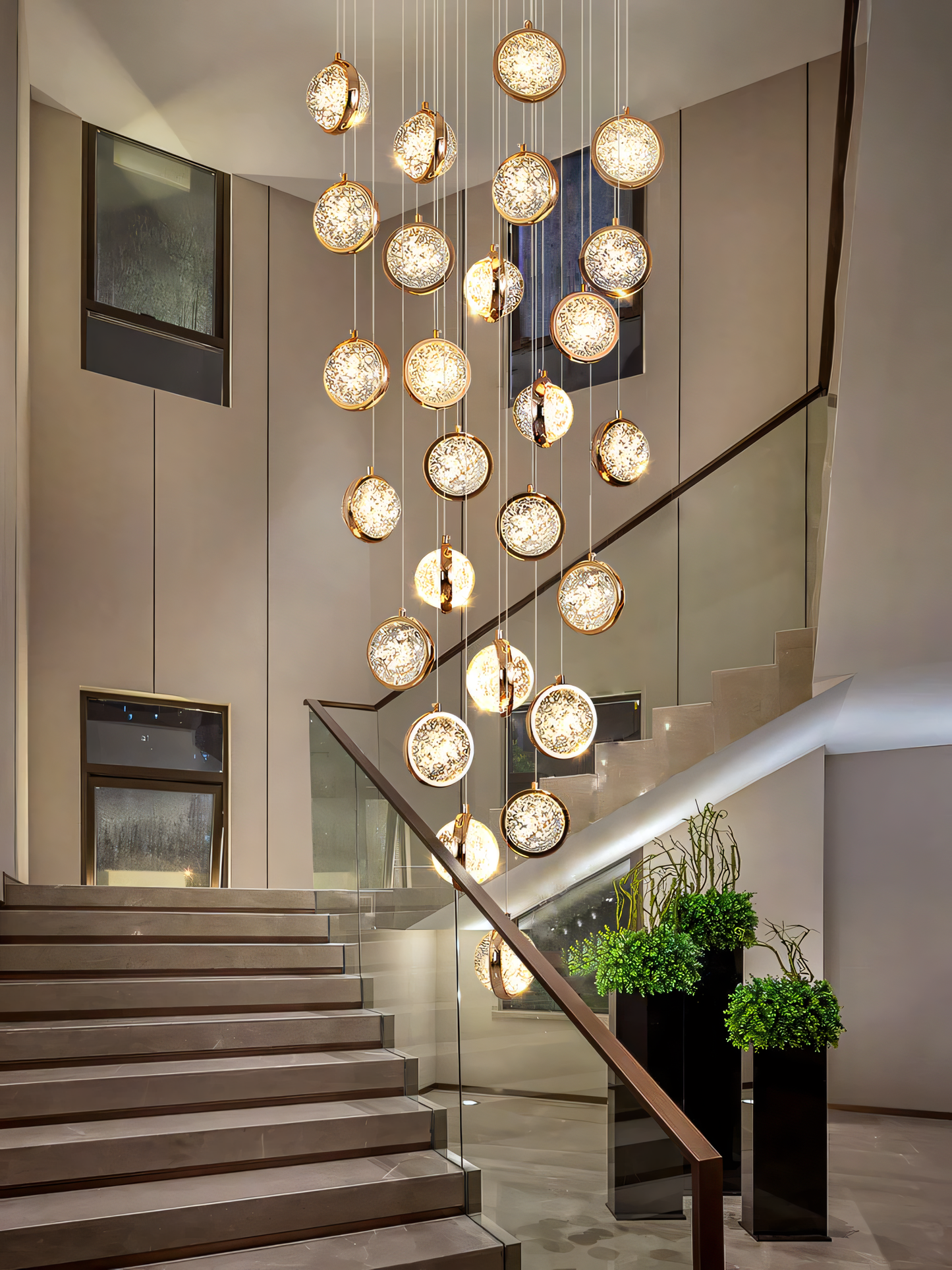 Double-height gold and acrylic LED chandelier