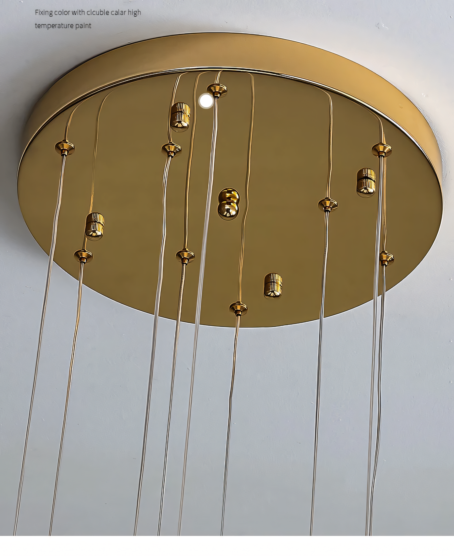 Elegant brass and crystal 6-light LED chandelier cascading down a tall staircase in a modern, luxury home interior