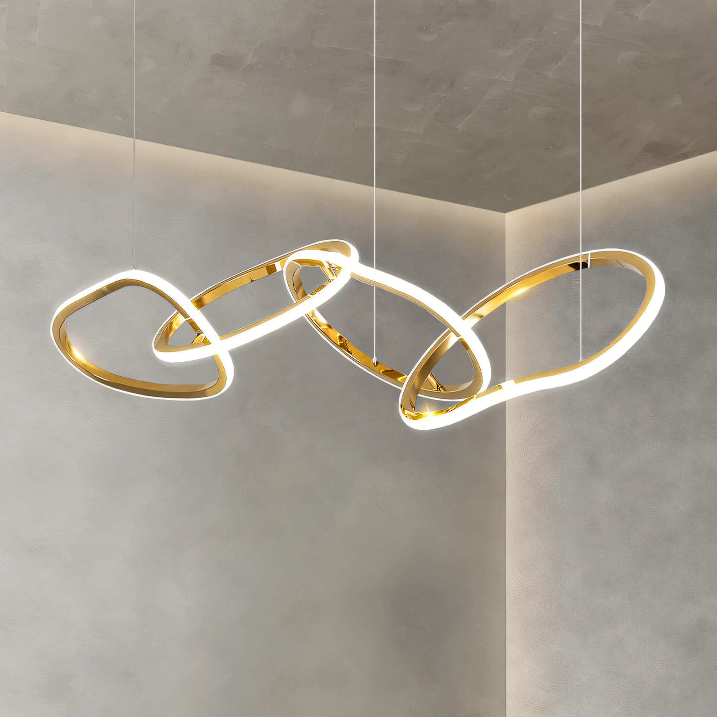 Elegant gold chandelier with four cascading rings adds a touch of modern sophistication to any space.