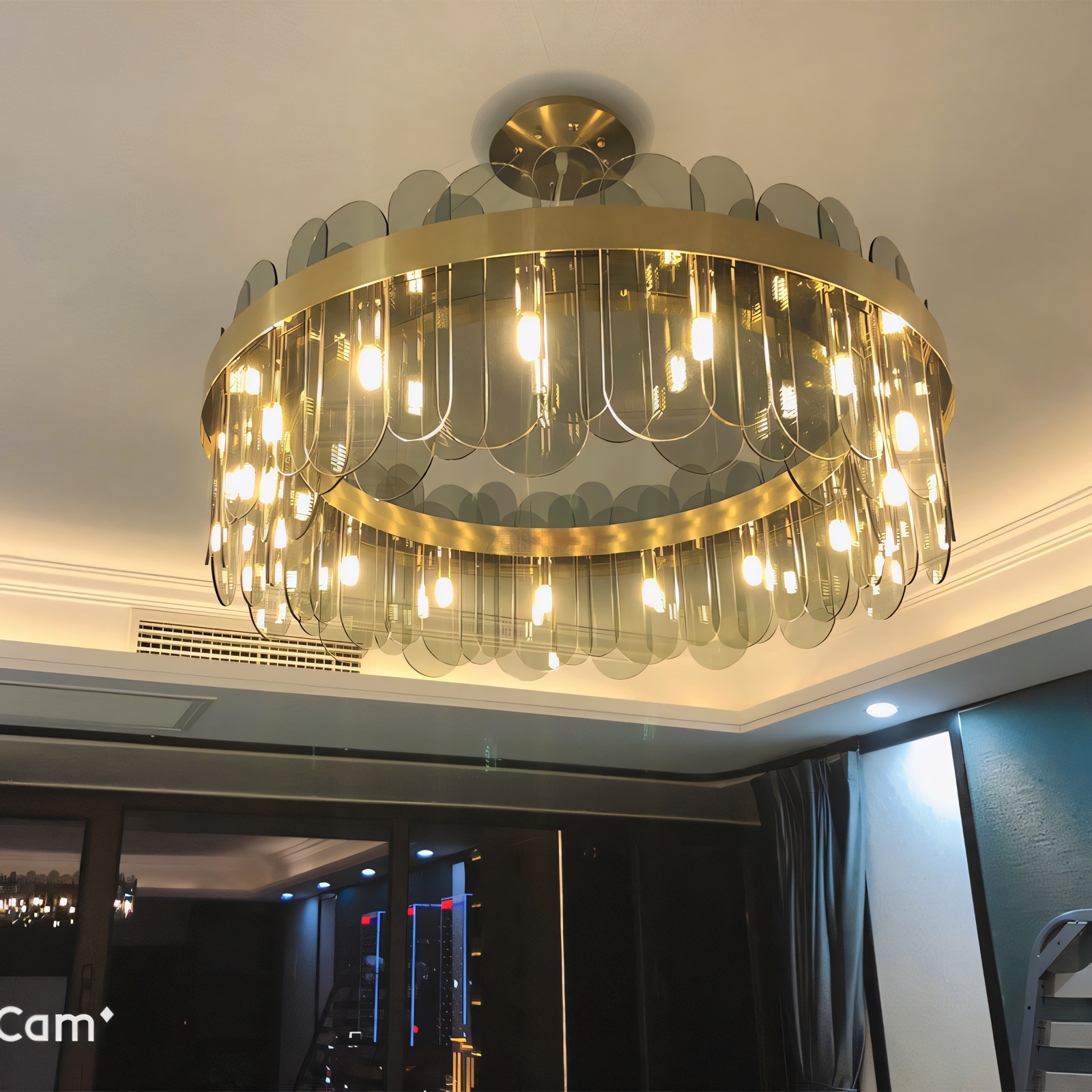 Elegant 600mm Gold Brass Chandelier with Smokey Glass panels creates a captivating display of light and shadow. Perfect for living rooms, dining rooms, and more.