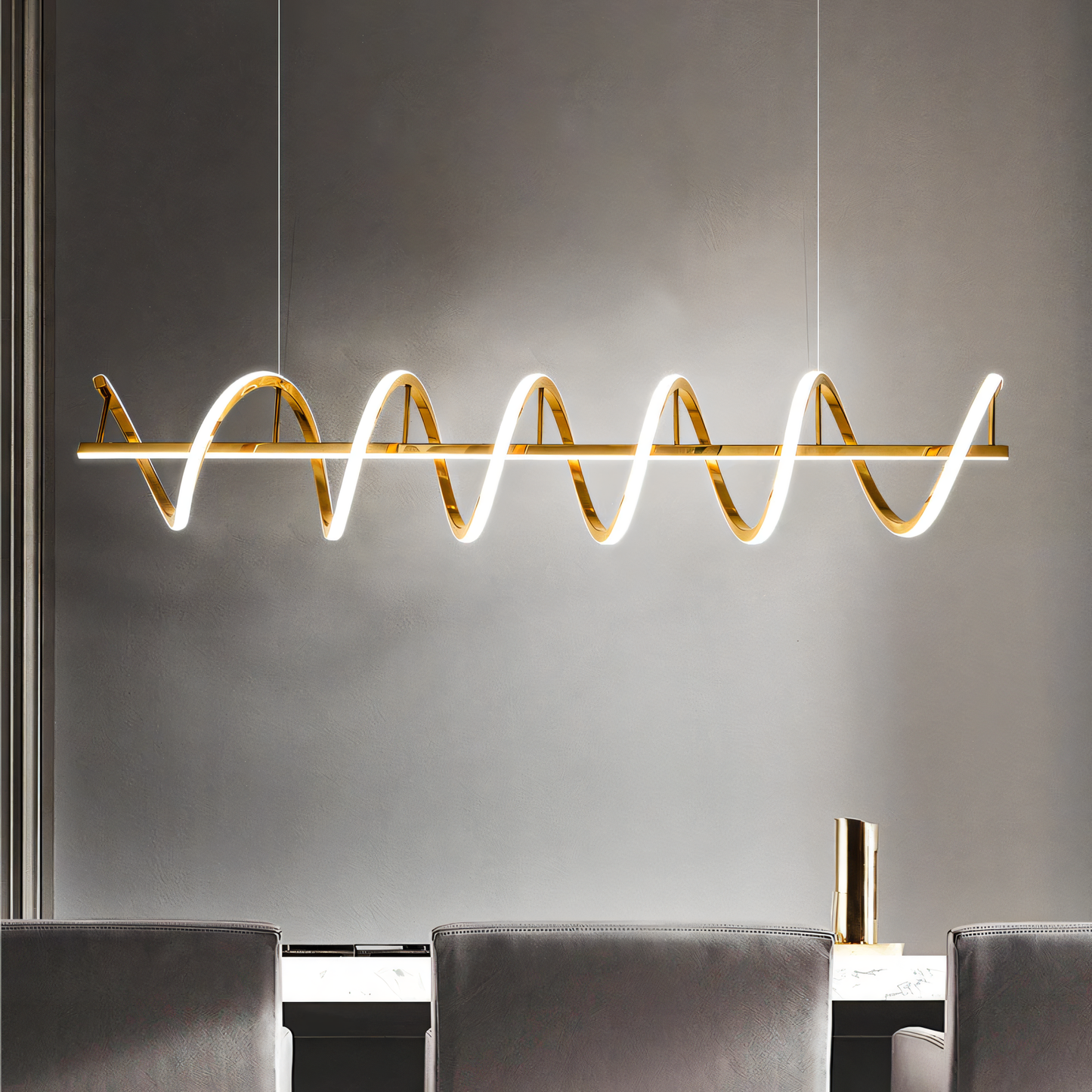 Glossy gold pendant chandelier with twisting, curling lights in a magical home