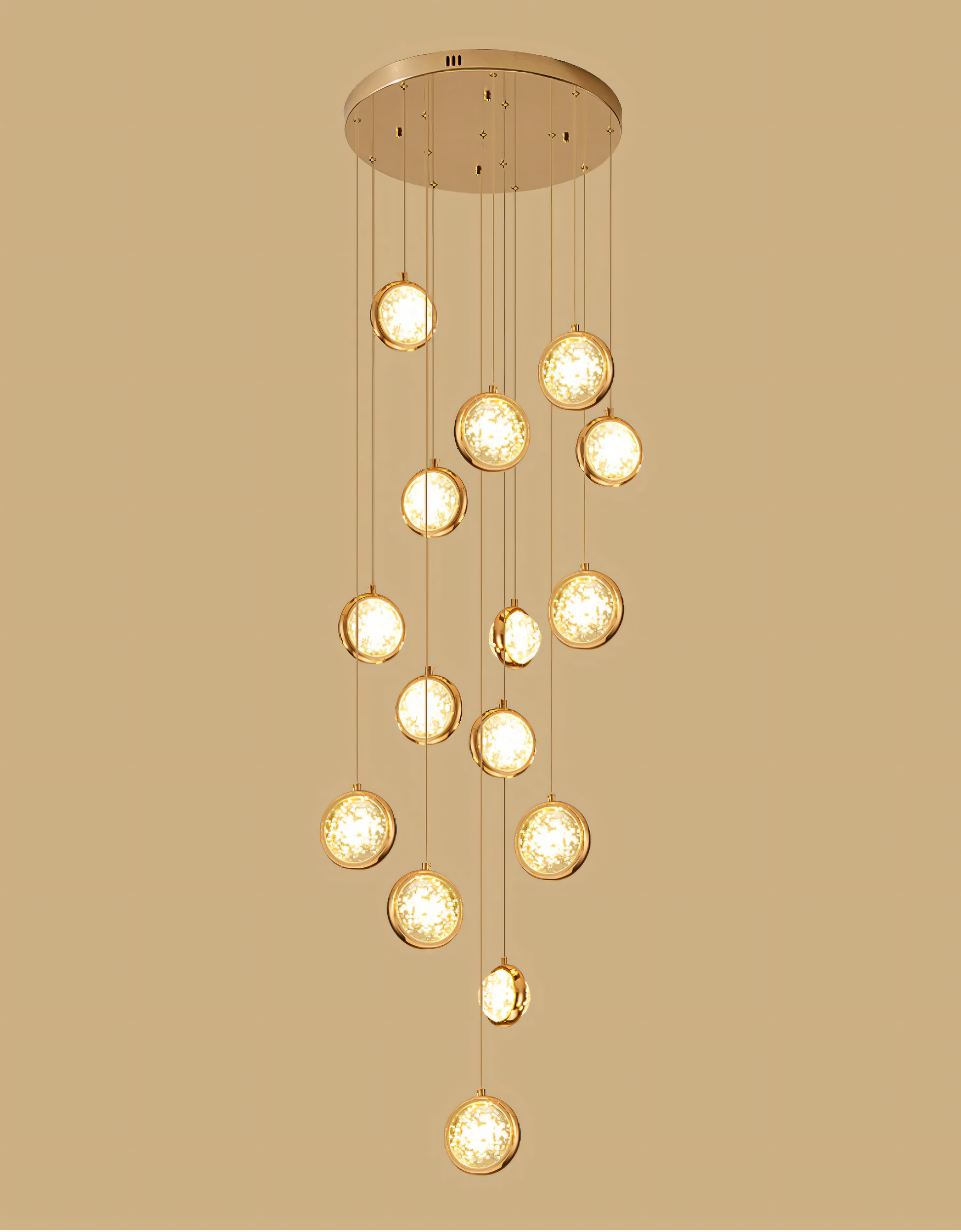 Dramatic gold and acrylic double-height chandelier