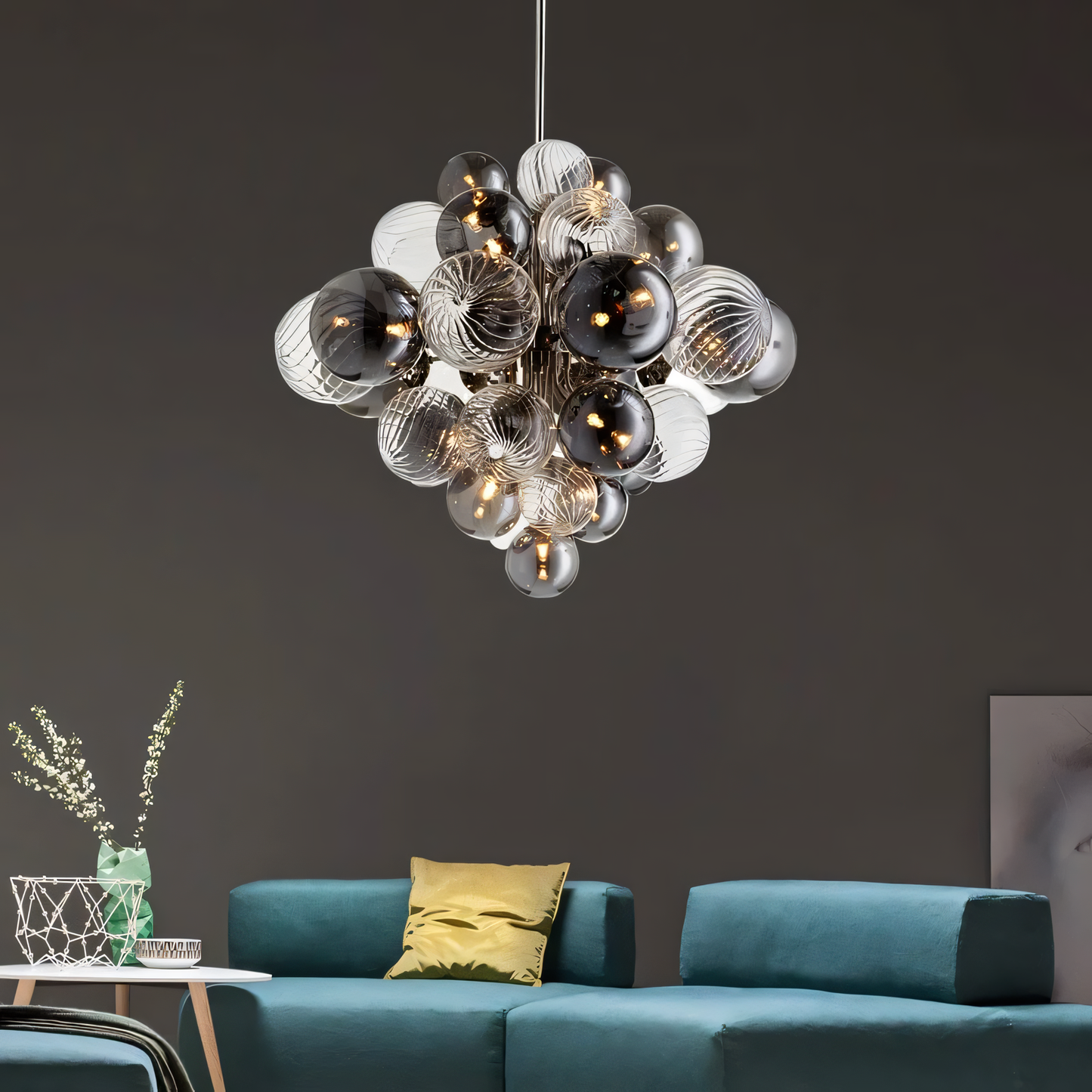 Warm LED light illuminates a captivating mix of smokey and clear glass globes in this modern chandelier.