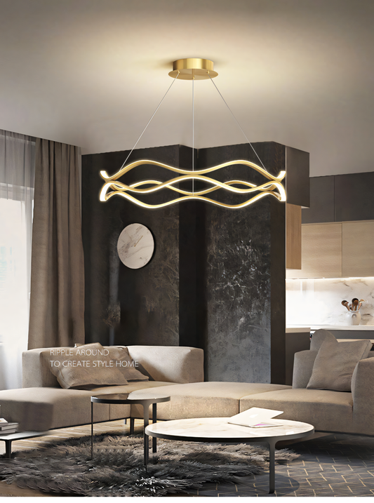 600MM Gold LED Curvy Profile Chandelier Lamp in a beachside villa living room