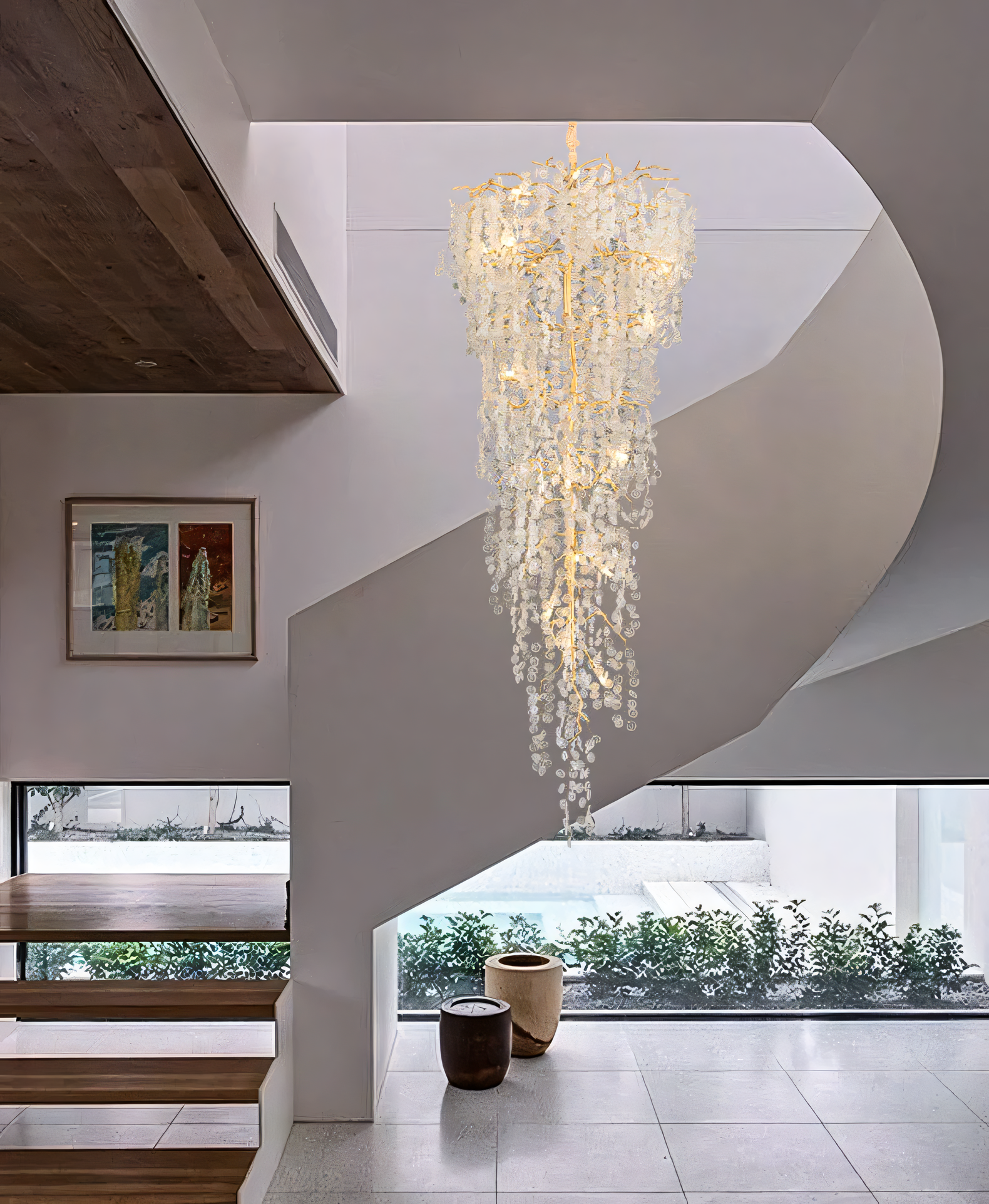 Cascading crystal glass panels in grand entryway chandelier