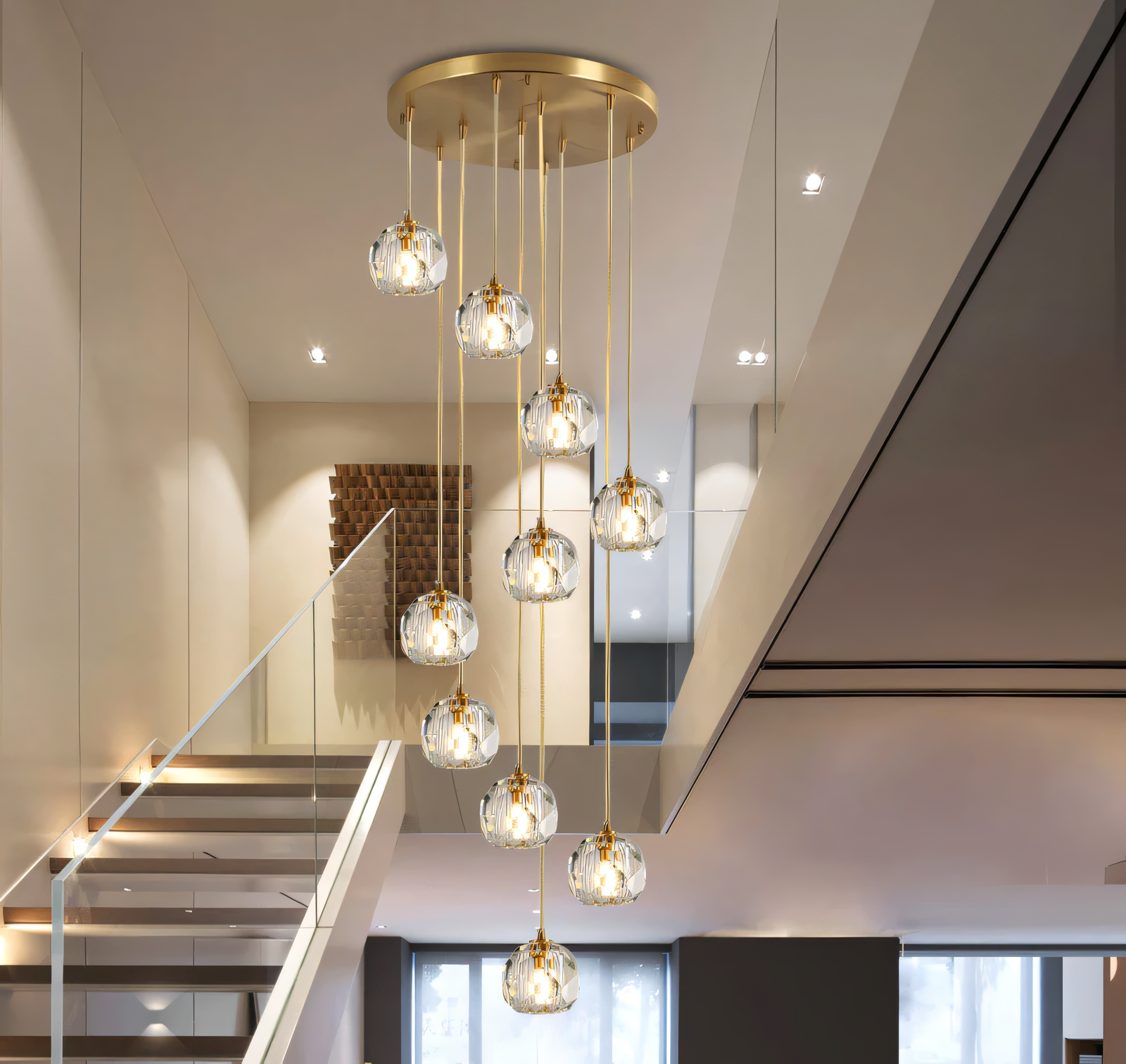 Dramatic double-height gold chandelier