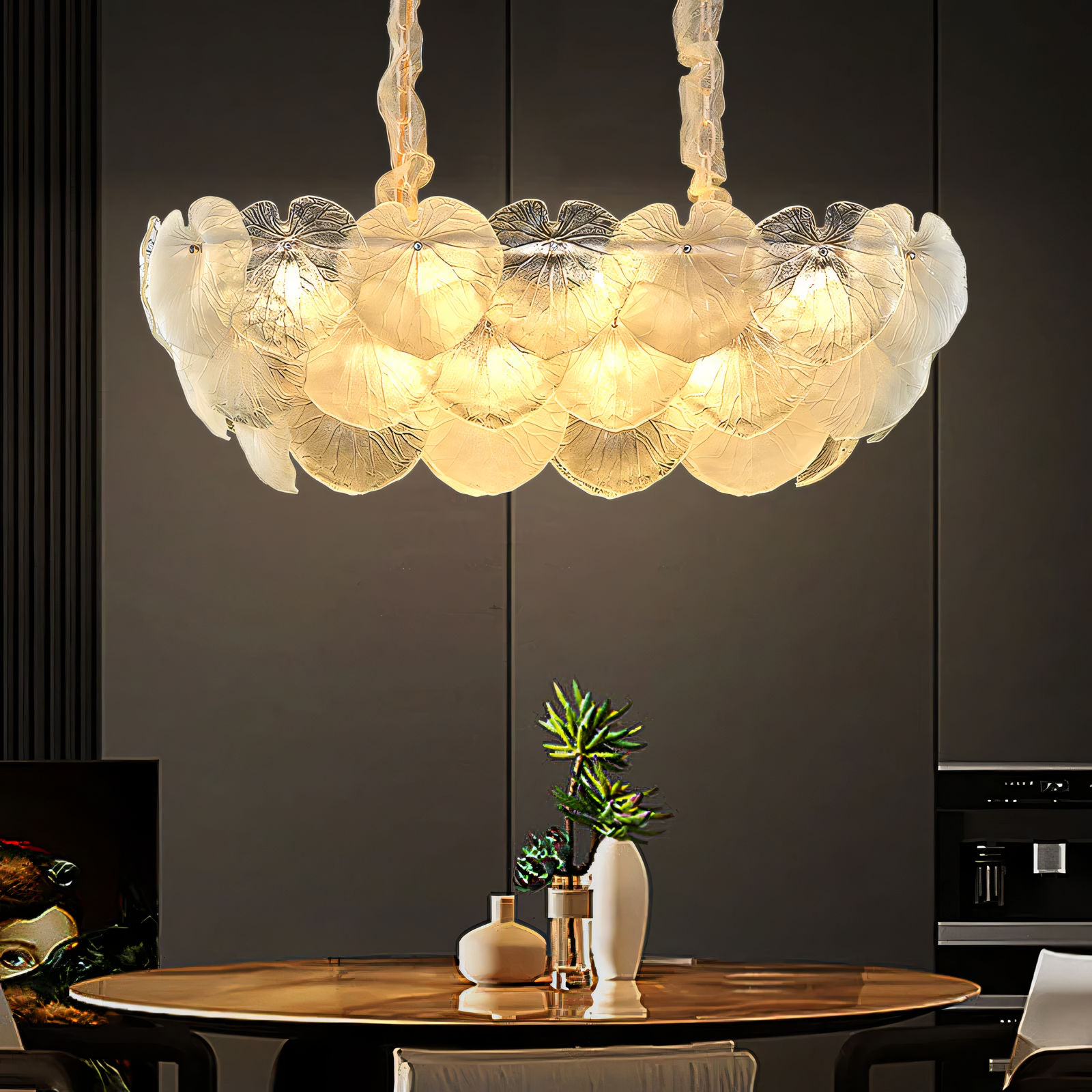 Warm LED chandelier with delicate gold leaf design