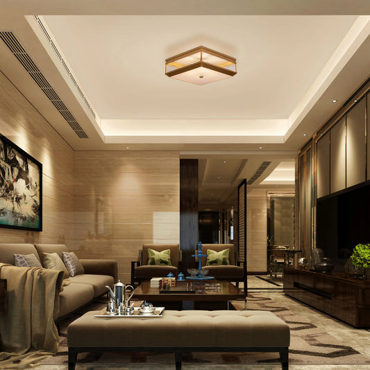 Live & Learn Gold Ceiling Light casting a warm glow in an elegant living room