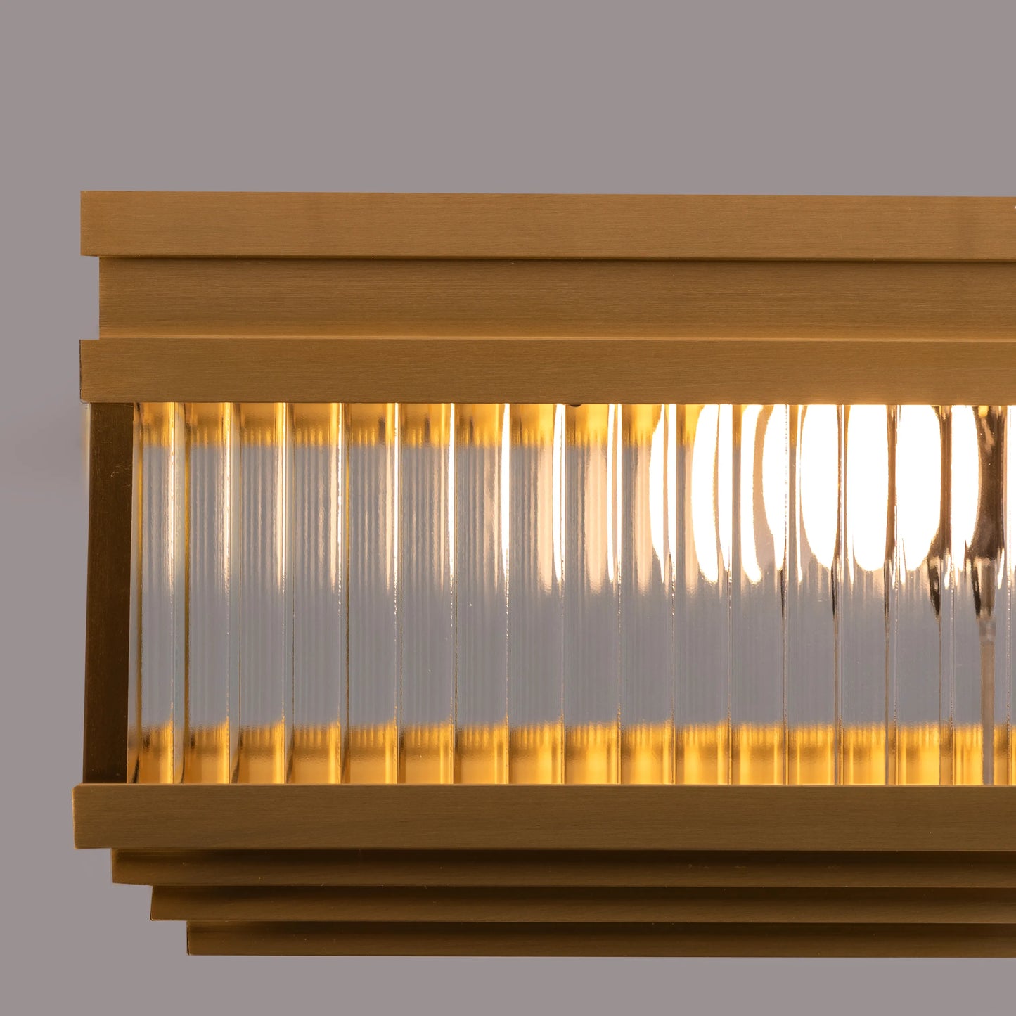 Live & Learn Gold Ceiling Light casting a warm glow in an elegant living room