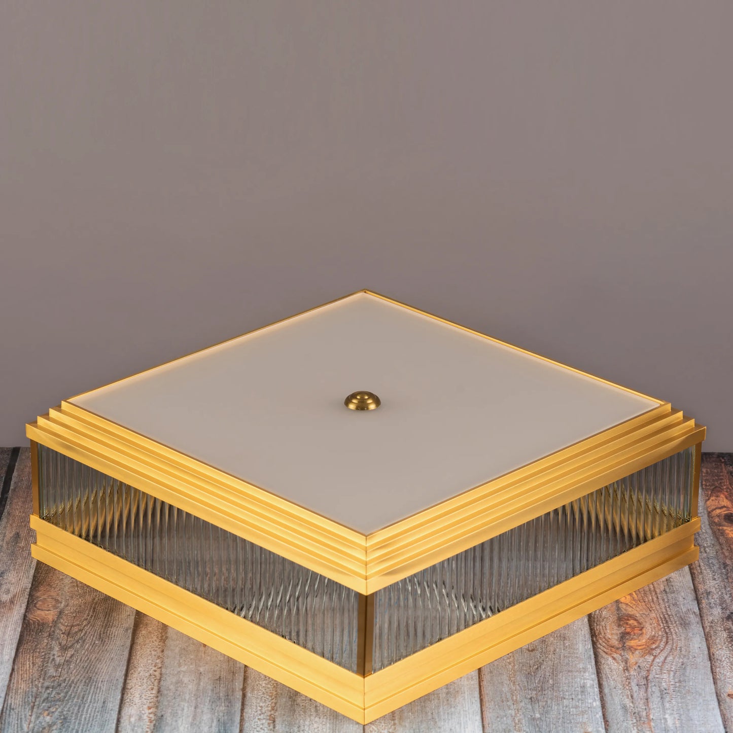 Live & Learn Gold Ceiling Light casting a warm glow in an elegant living room