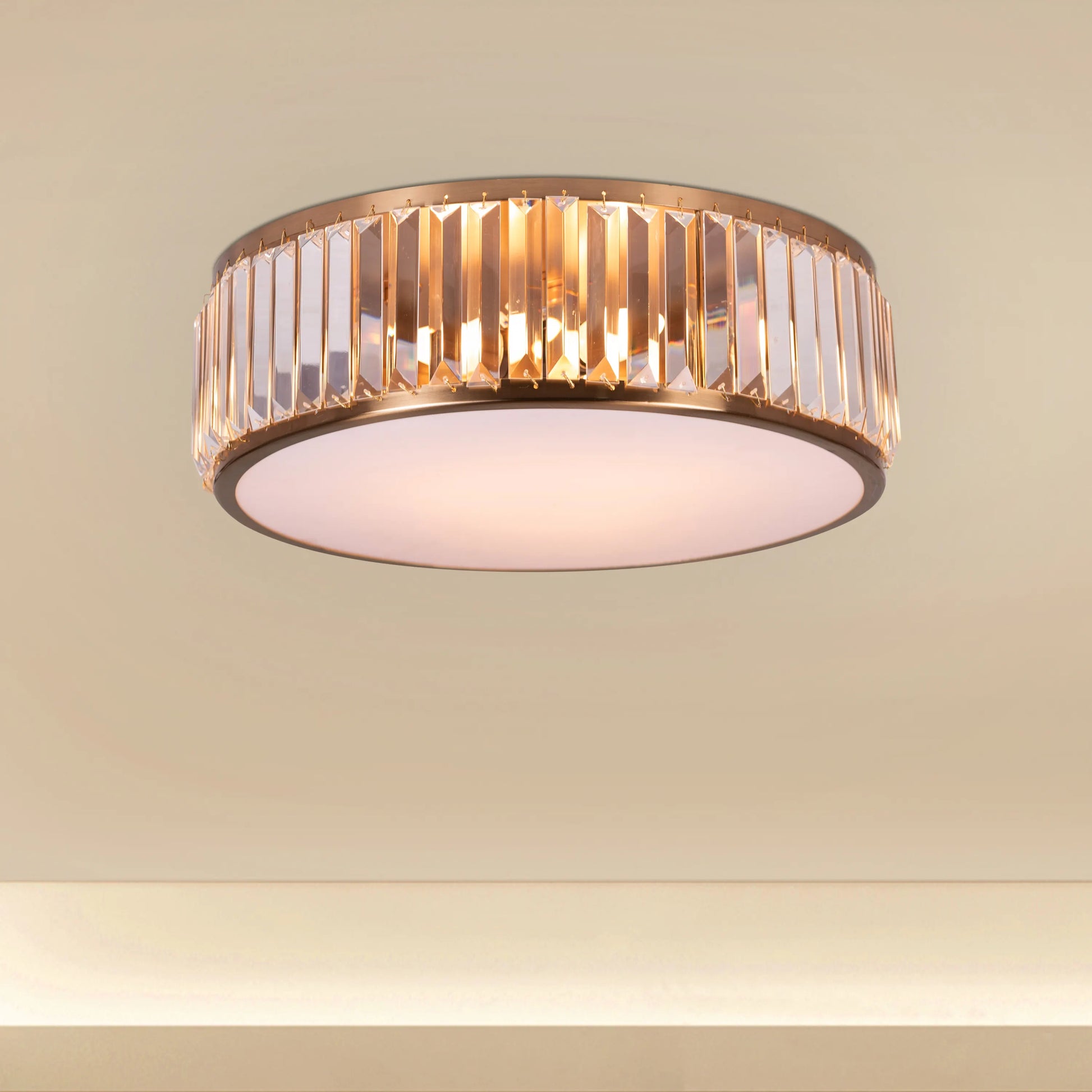 Matinee Gold Crystal Ceiling Light featuring cascading crystal droplets suspended from a circular gold frame, creating a luxurious and sparkling illumination for elegant spaces.