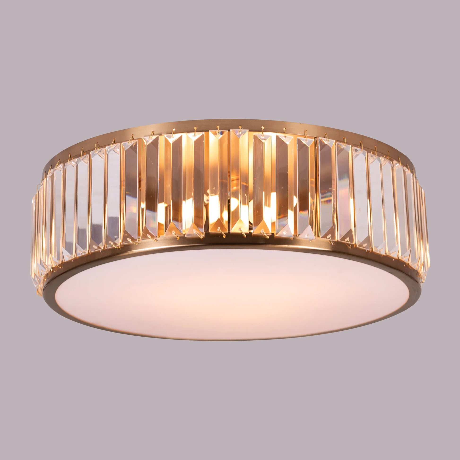 Matinee Gold Crystal Ceiling Light featuring cascading crystal droplets suspended from a circular gold frame, creating a luxurious and sparkling illumination for elegant spaces.