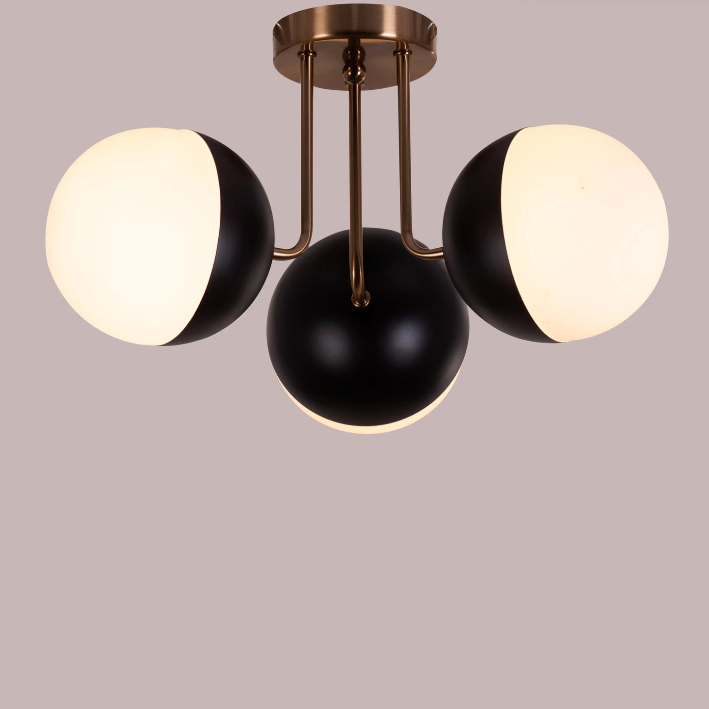 Contemporary ceiling light with a striking gold and black finish.