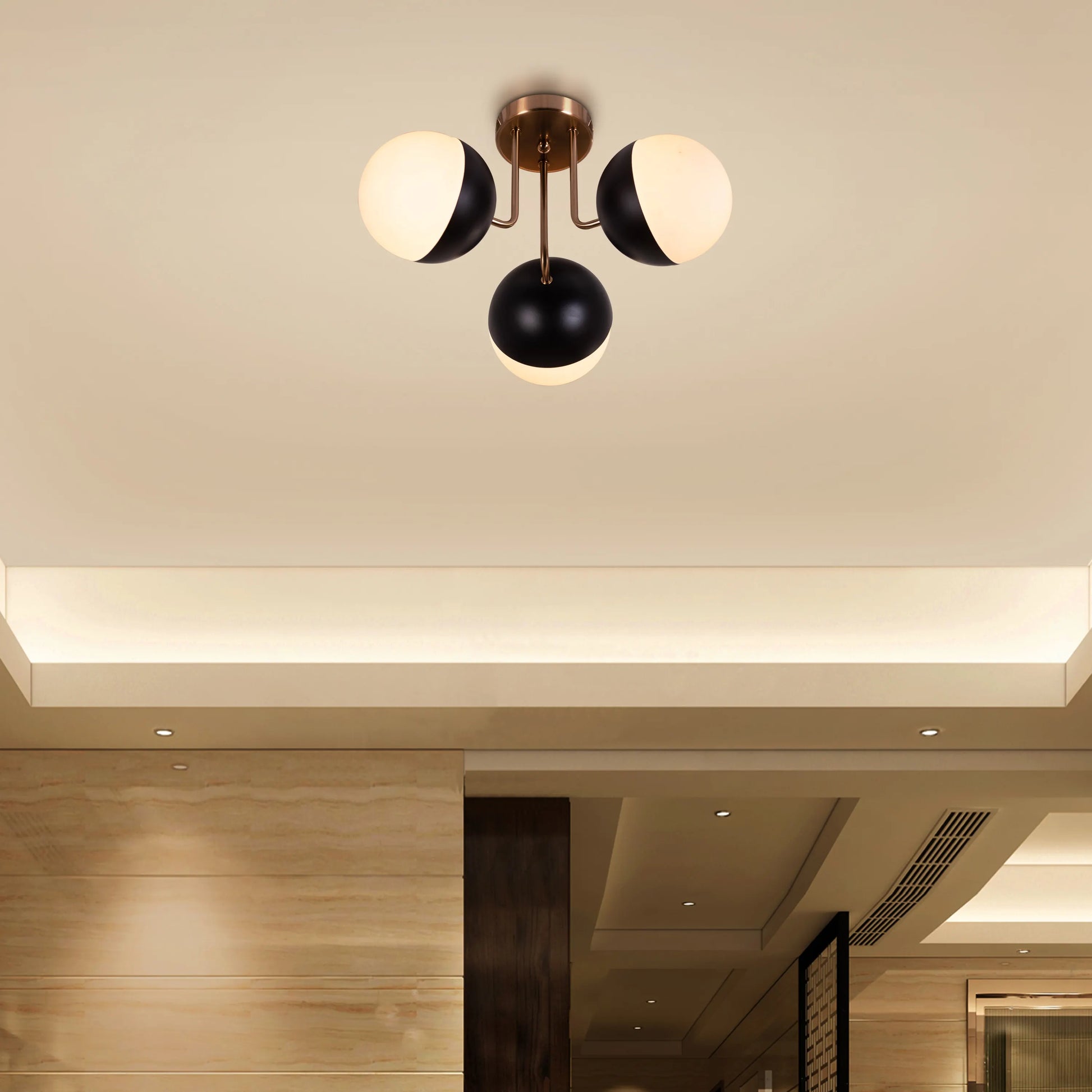 Addiction ceiling light with bold gold and black design.