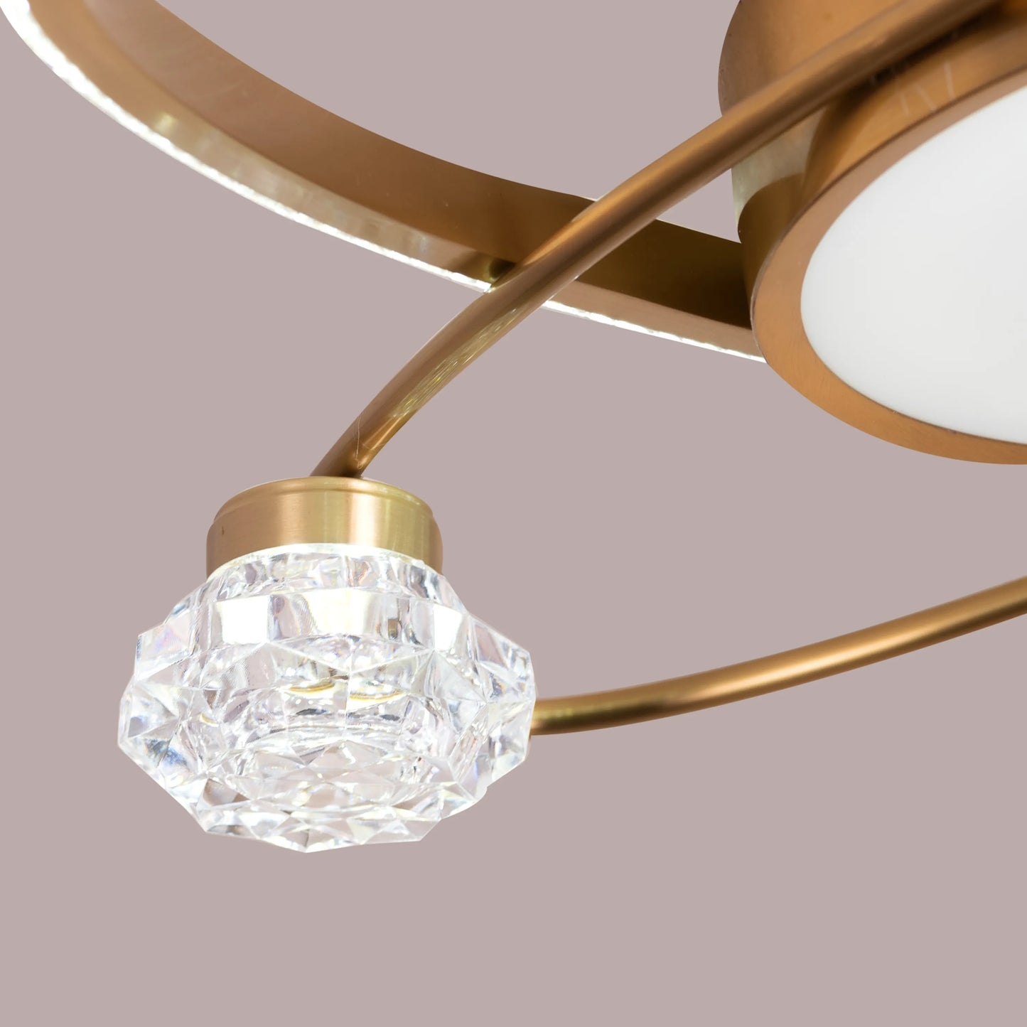 Gold ceiling light with dimmable LED and crystal details.