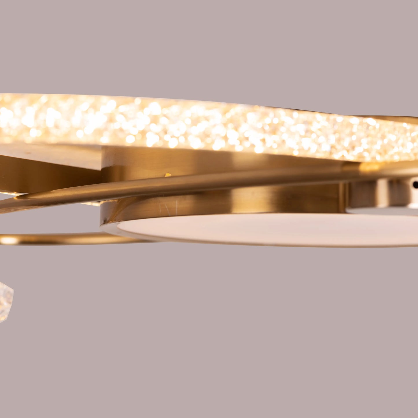 Modern gold crystal ceiling light with dimmable LED features.