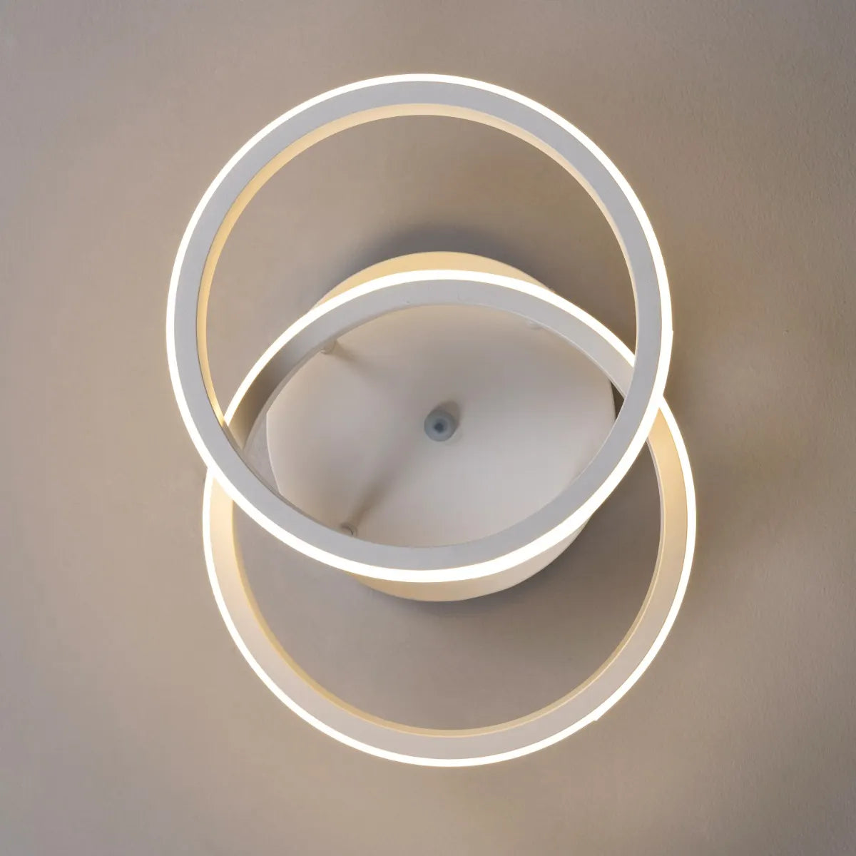 White ceiling light with remote control and adjustable color settings.