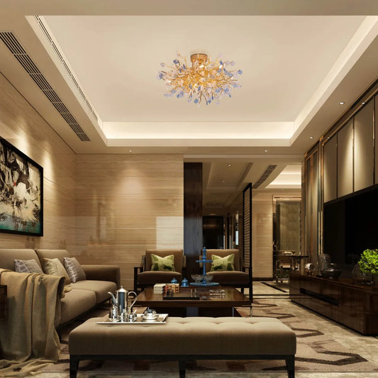 Yacht Life Gold Crystal Ceiling Light illuminating an elegant living room with a warm, luxurious glow