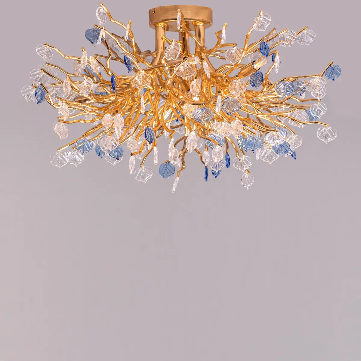 Yacht Life Gold Crystal Ceiling Light illuminating an elegant living room with a warm, luxurious glow