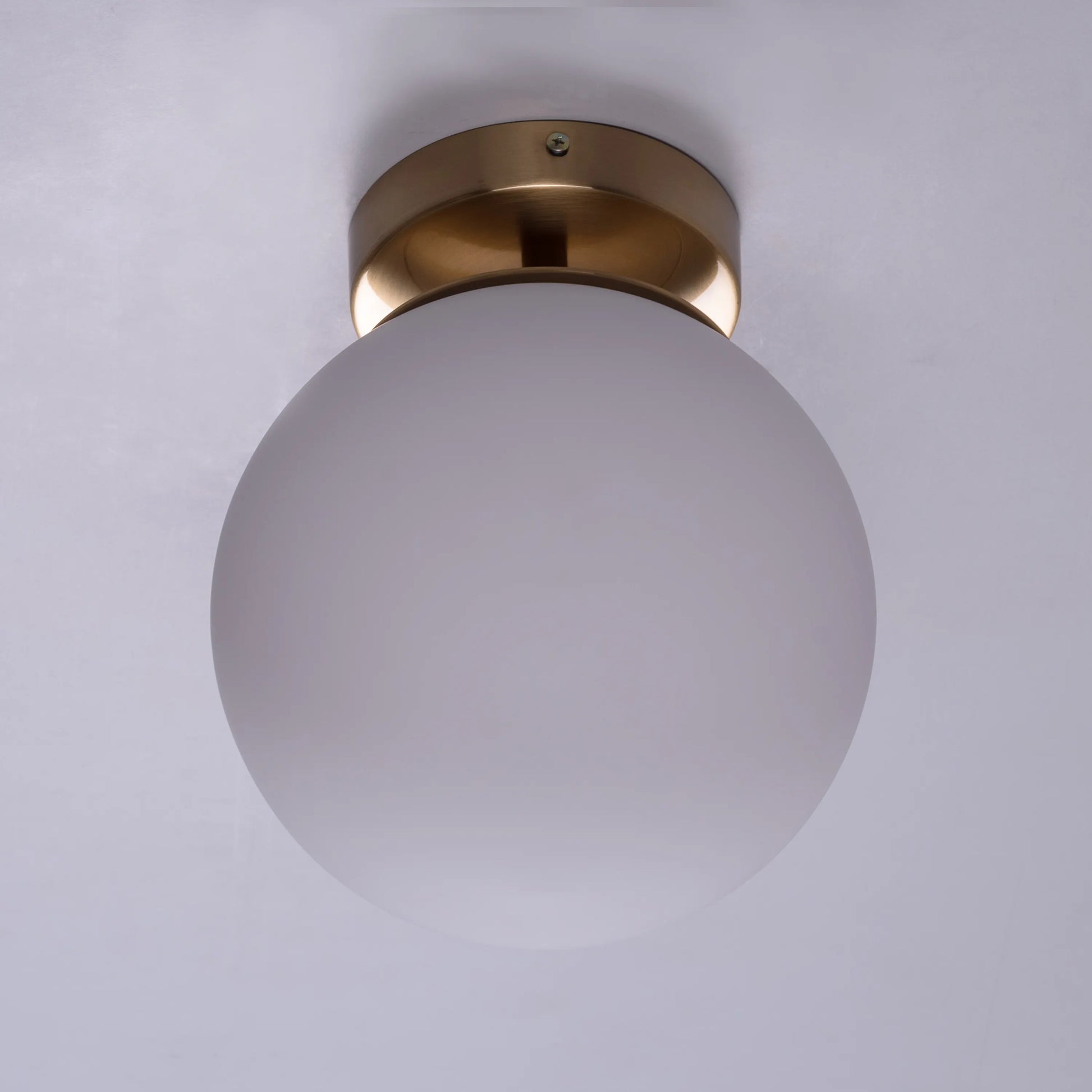 Single Life Small Gold Ceiling Light illuminating a cozy bedroom corner