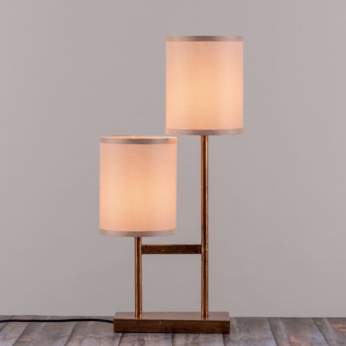 Twin tower-inspired gold and marble lamp design