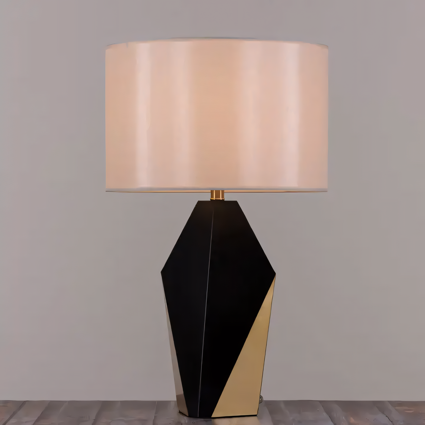 Soft, ambient lighting from the Checklist (Black, Gold) Ceramic Table Lamp