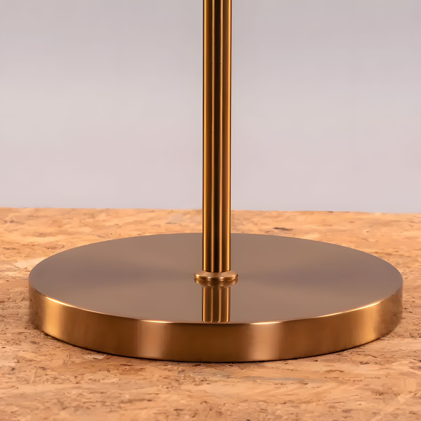 Sleek and modern gold metal floor lamp