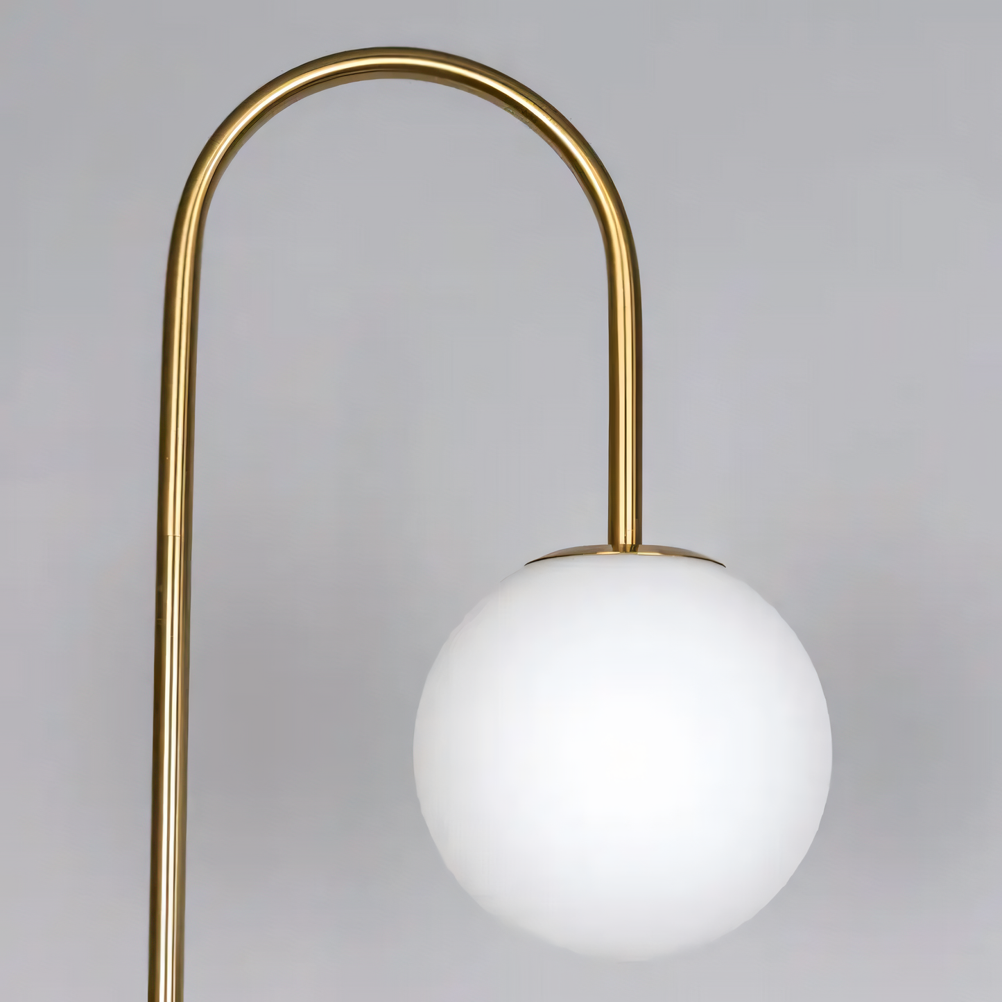 Curved neck and white glass shade design of the floor lamp